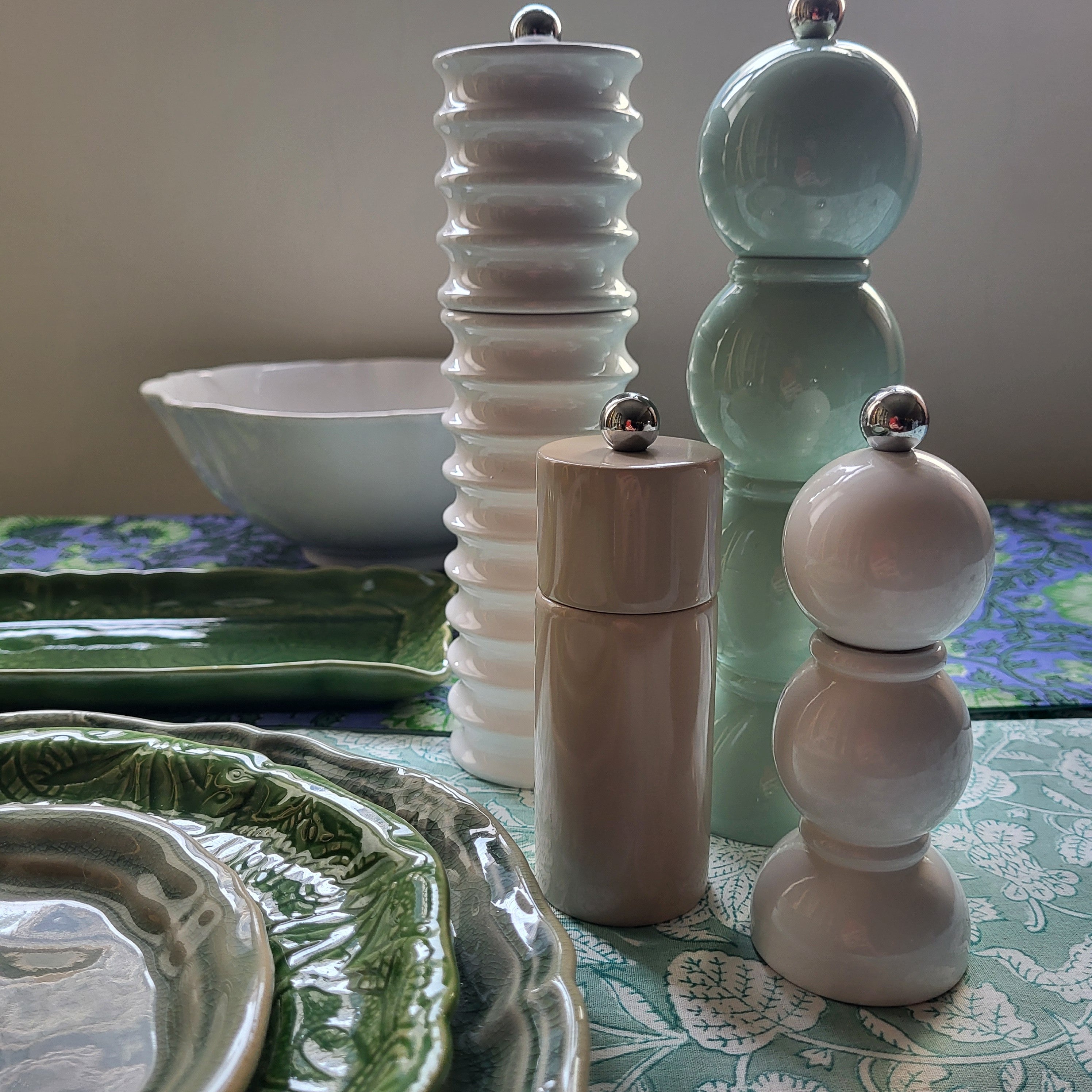 Group of bobbin salt and pepper mills in assorted lacquers