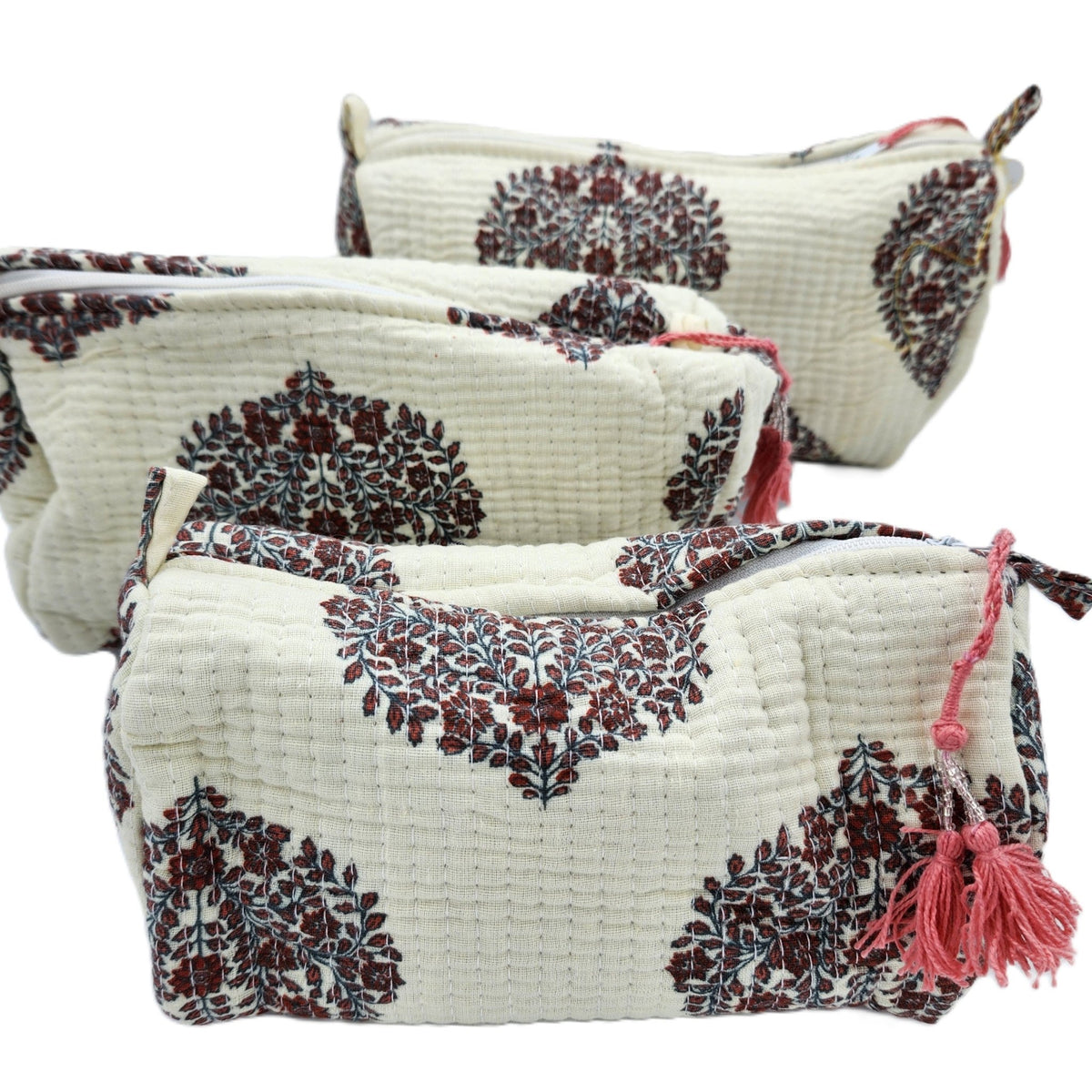 Handmade block print wash bag in the Boteh floral design, lined with four pockets and a zip closure.