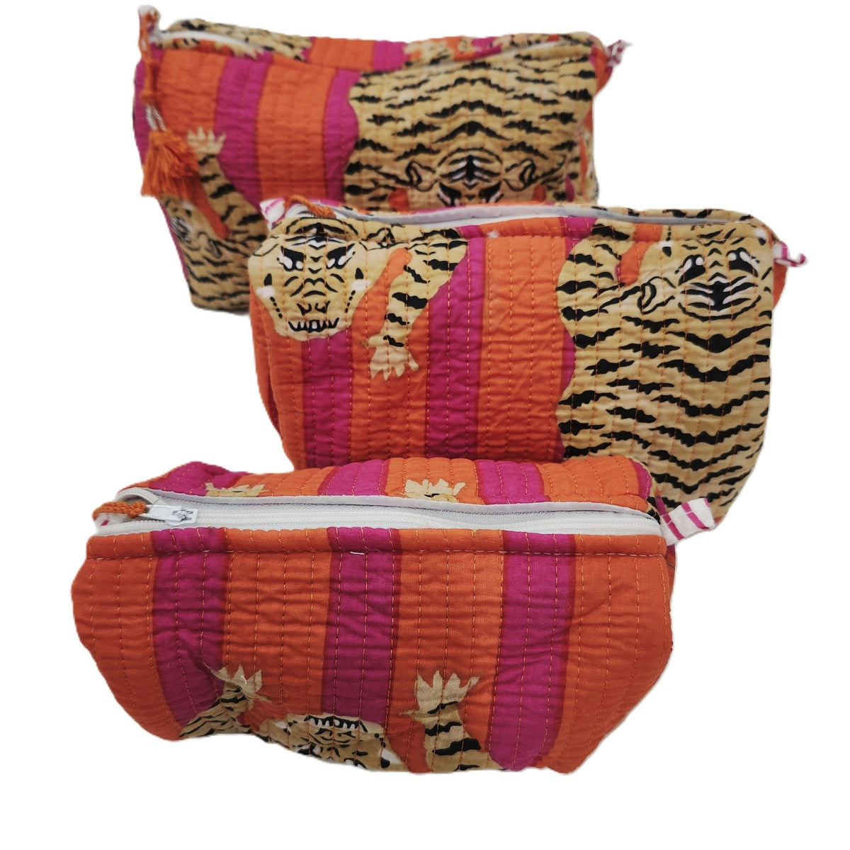 Handmade block print wash bag in a tiger design, lined with four pockets, a zip and a tassel pull.