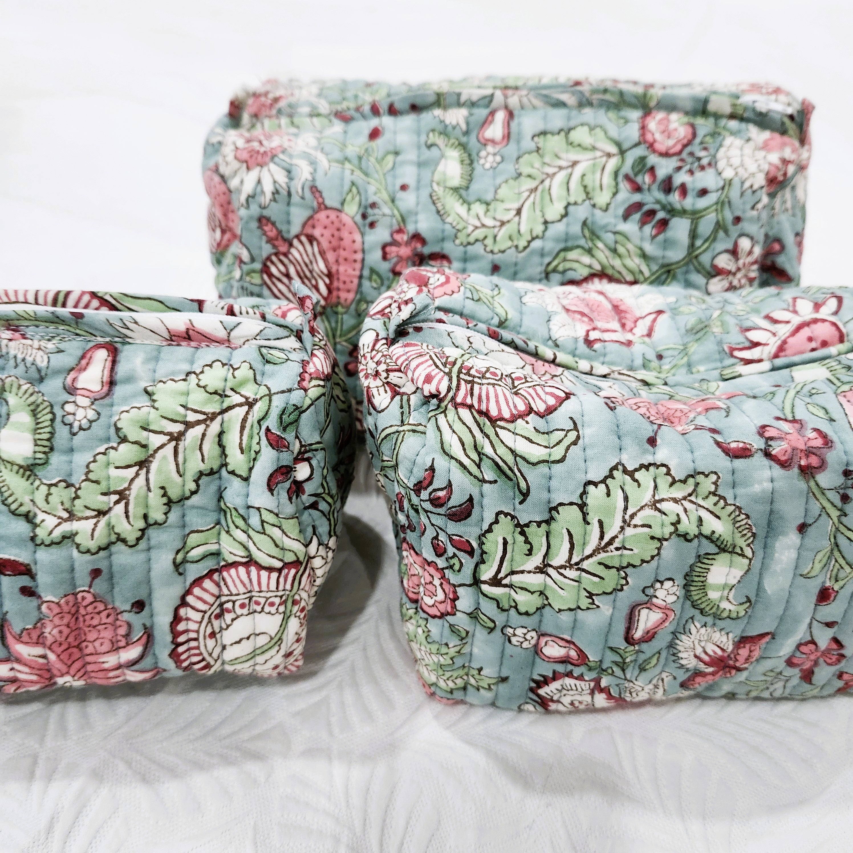 Hibiscus block-print wash bag with a tassel zip