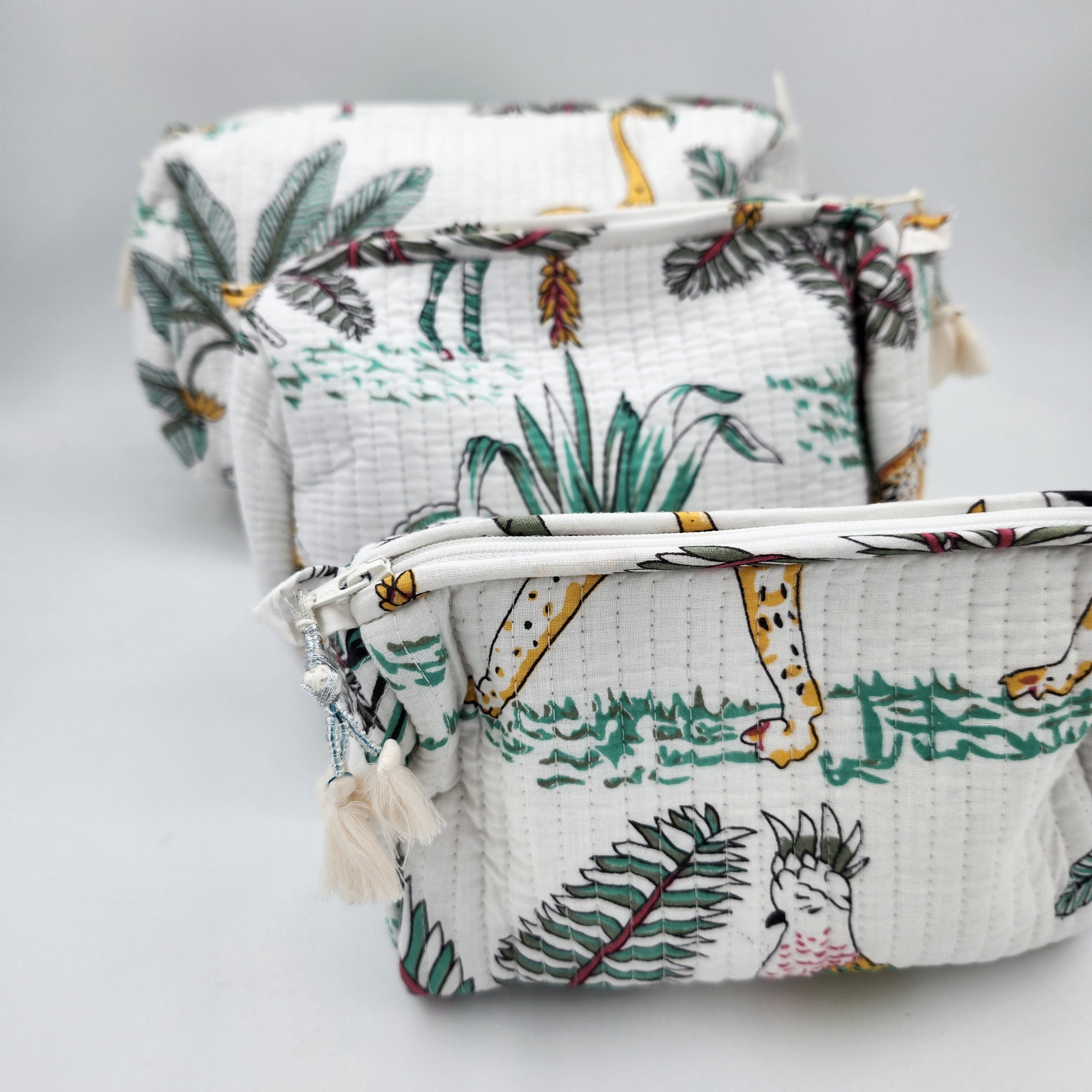 Safari block-print wash bag in white with zebras, cheetahs and palms