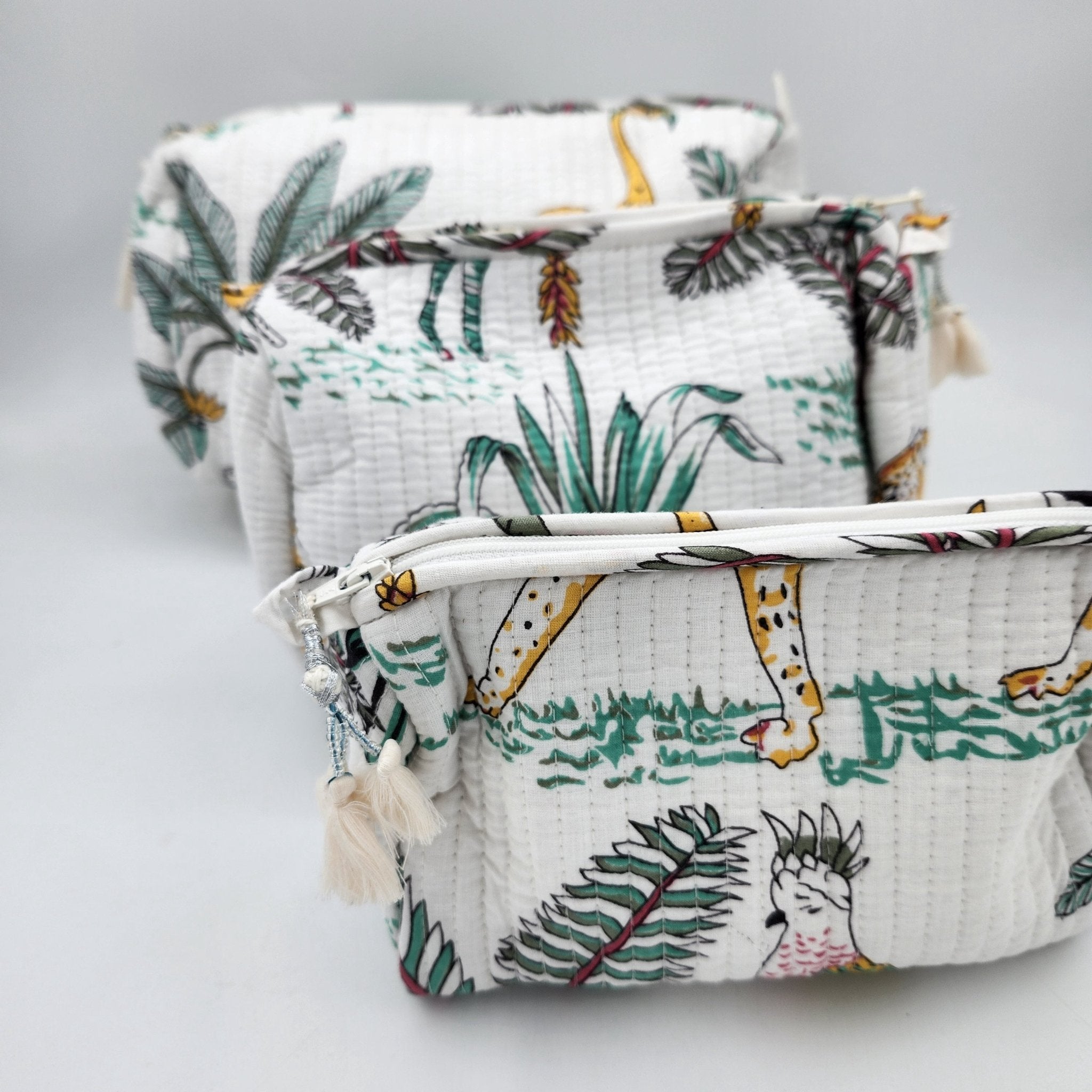 Safari block-print wash bag in white with zebras, cheetahs and palms