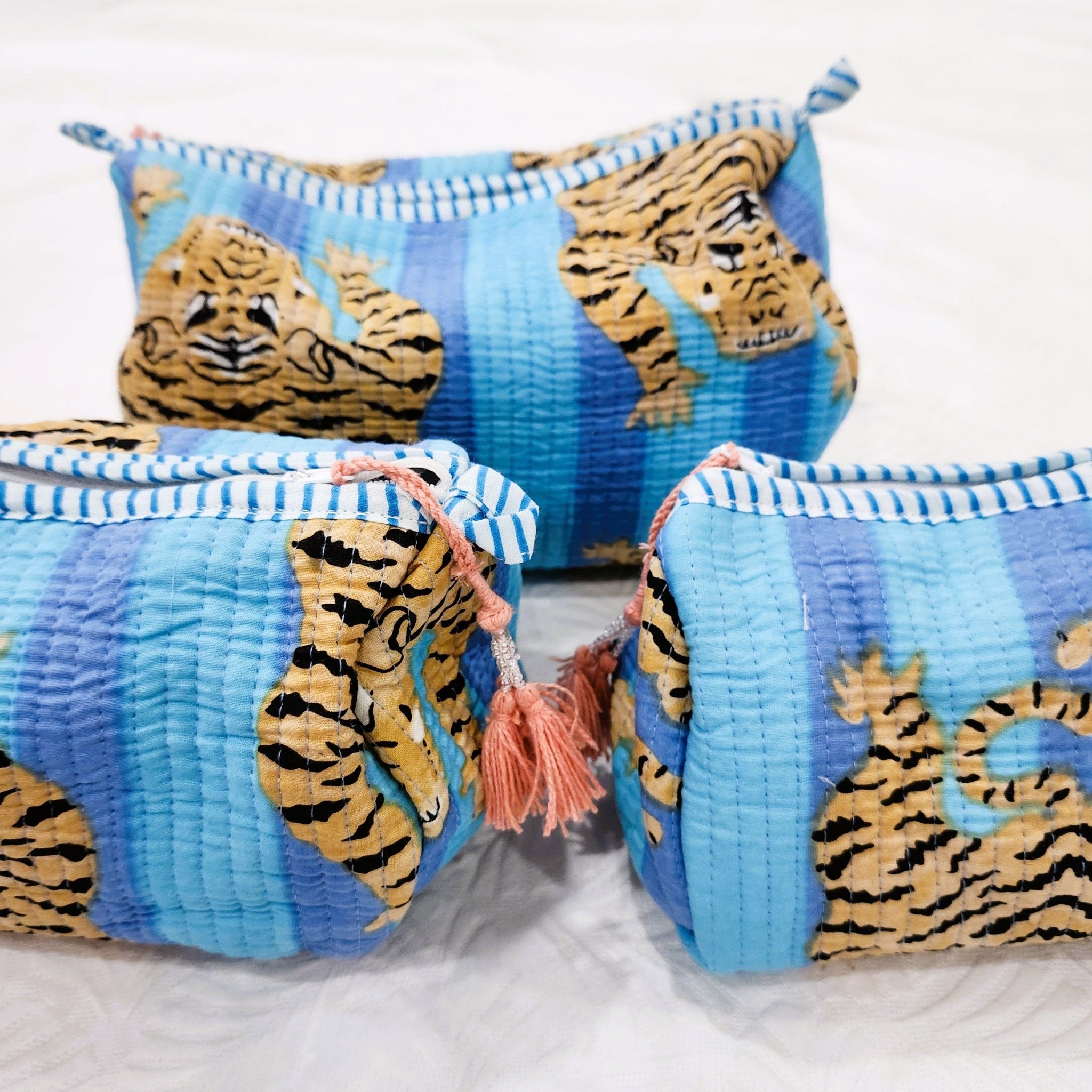 Tiger block-print wash bag in turquoise