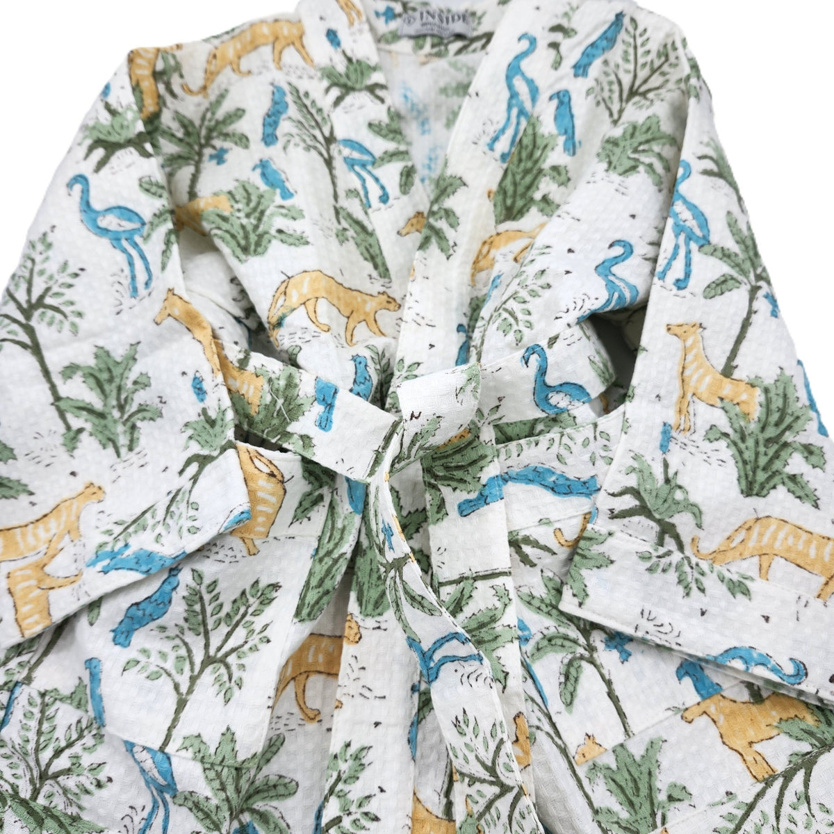 Child's cotton waffle bath robe block printed with a jungle of large cats, birds and trees, with a belt, ages 2 to 10