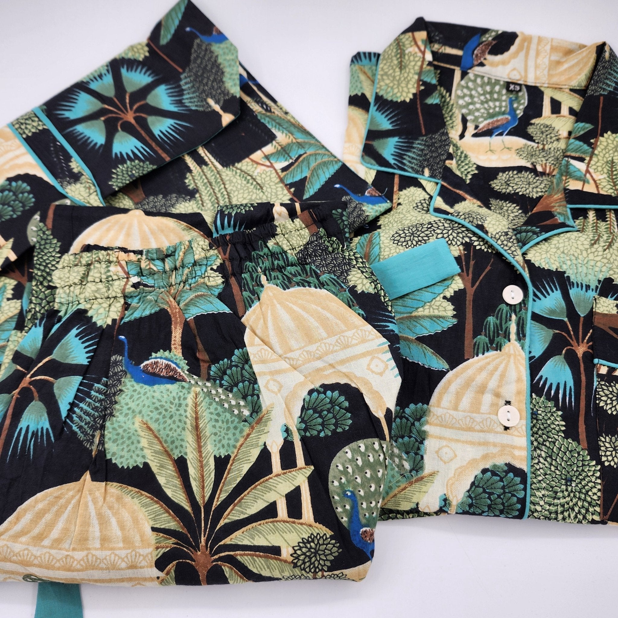 Paradise block-print long cotton pyjamas in black with teal trim