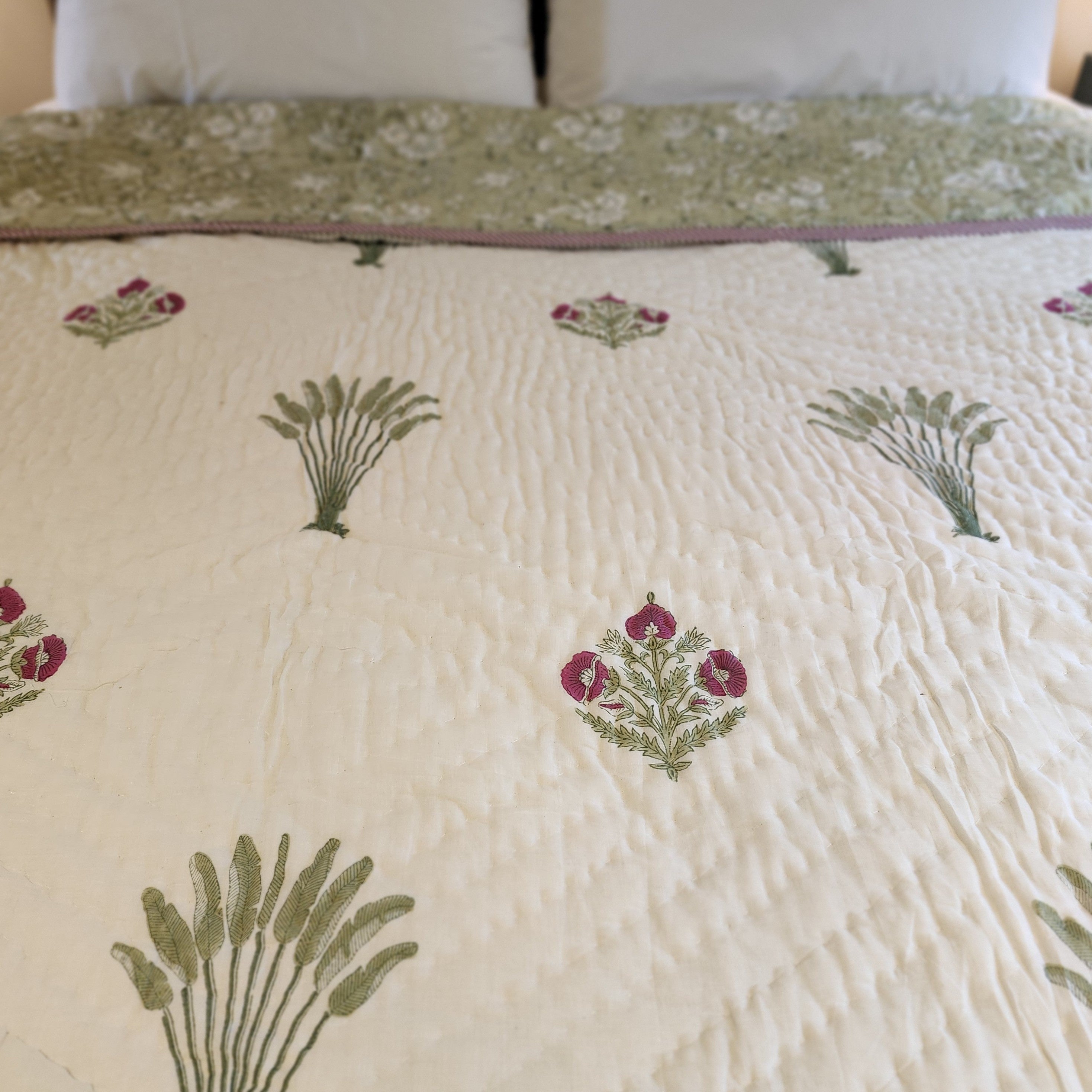 Queen block-print quilt with traveller's palms in green and pink on cream