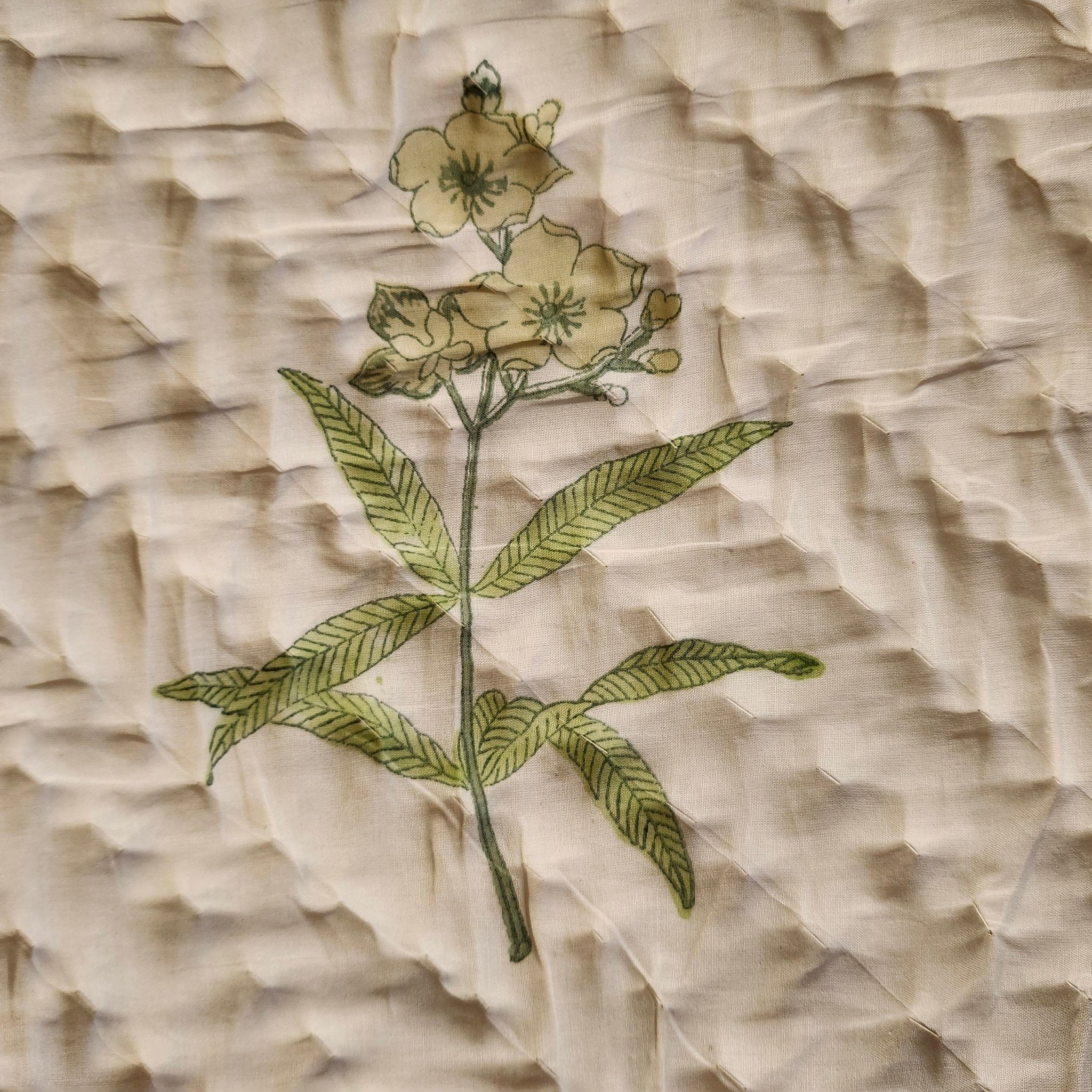 Yellow flowers block-print quilt with a striped border