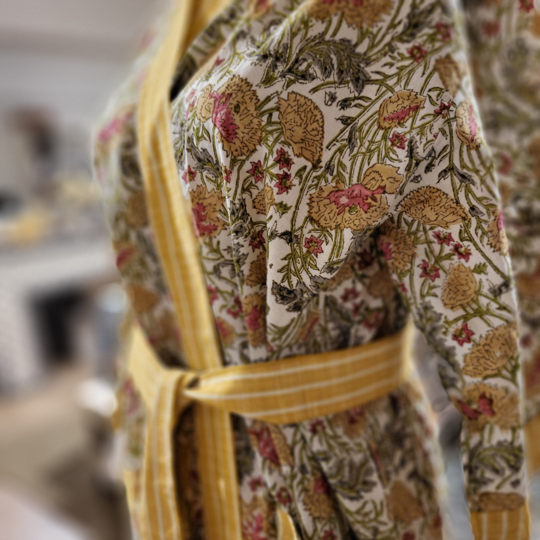 Flower meadow block print cotton bathrobe, yellow trim and belt, detail view