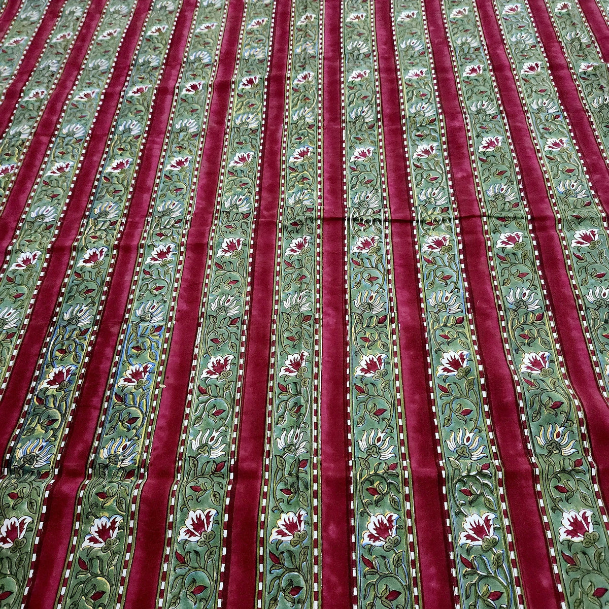 Cotton block print tablecloth in a deep burgundy red and green festive stripe, various sizes available.