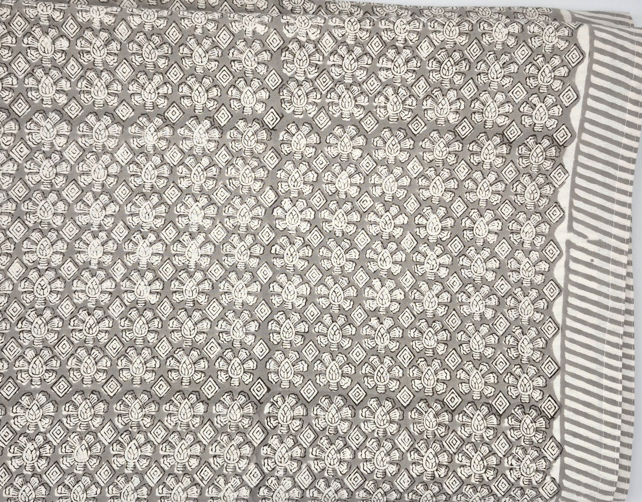 Geometric taupe block-print cotton tablecloth on white