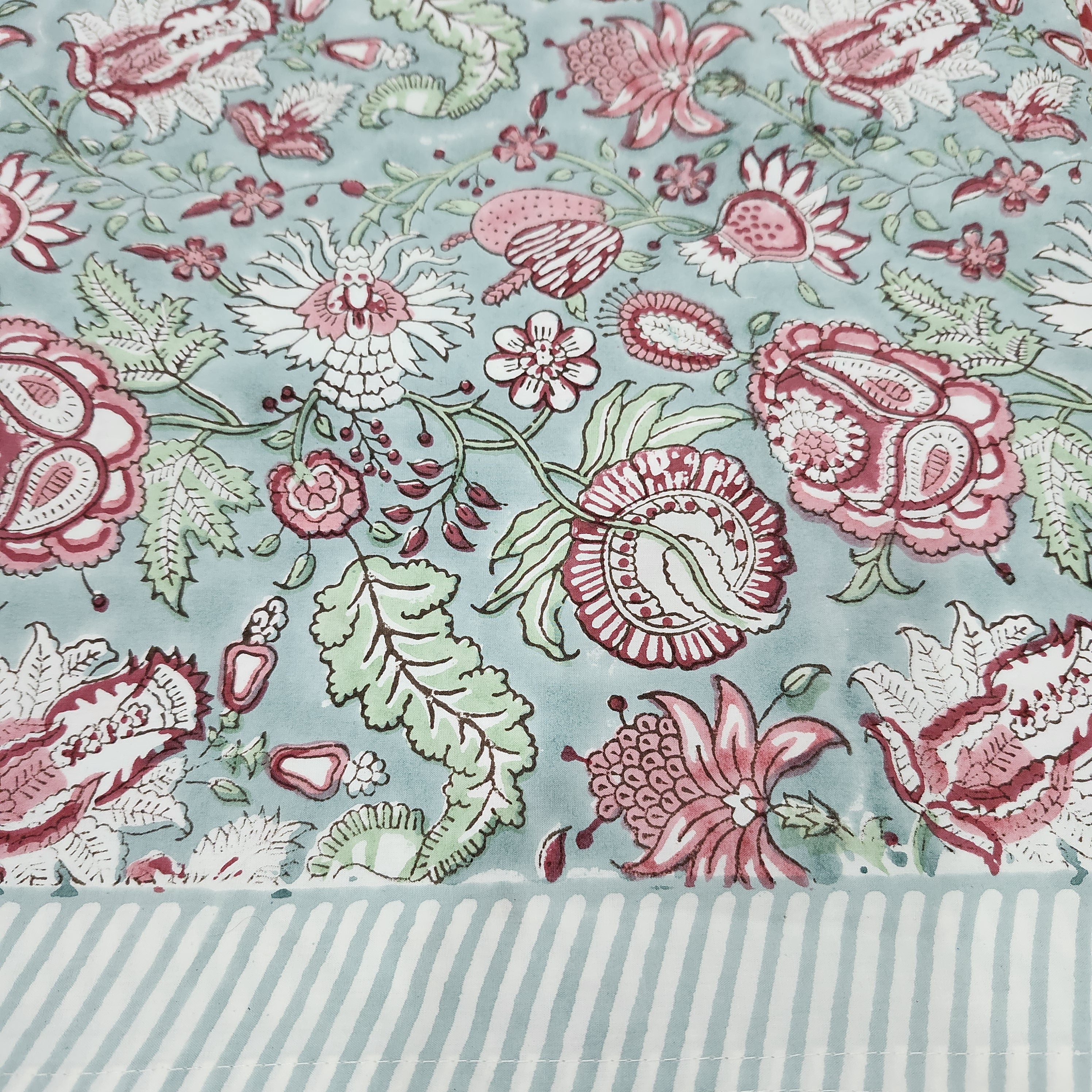 Hibiscus block-print cotton tablecloth, pink and green flowers on pale blue