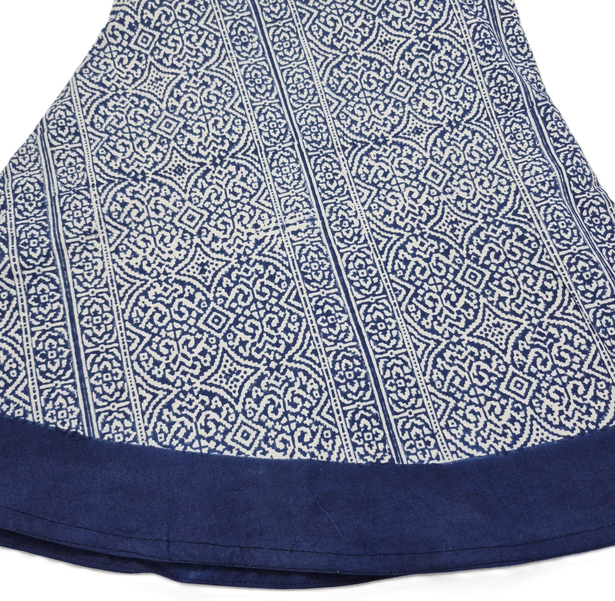 Round blue and white geometric and stripe block-print tablecloth with a contrast border