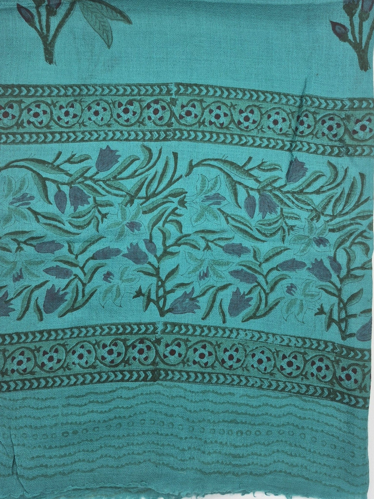 Block print wool shawl in a turquoise tulip design on a pale ground, soft and lightweight, 75 by 200cm.