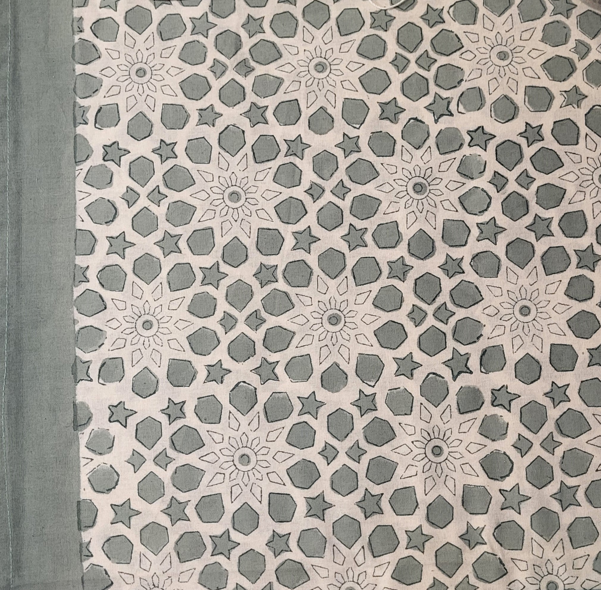 Bluey-green star block-print cotton tablecloth with floral and geometric motifs