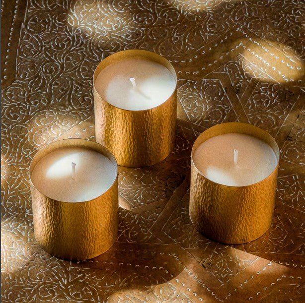 Cote Bougie Christmas gift set of three travel candles in hammered brass holders, pine and cypress scent