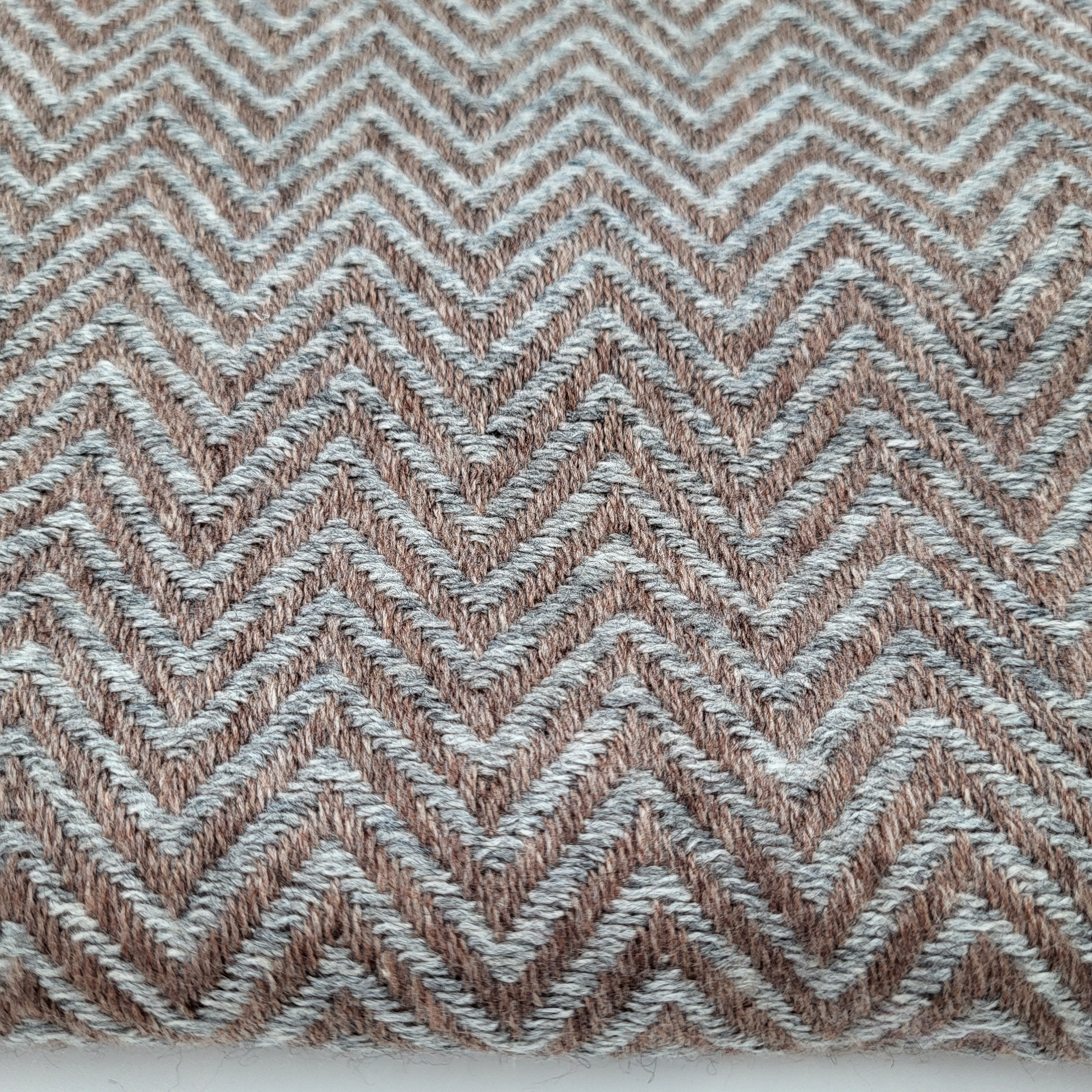 Cashmere herringbone shawl in grey, draped
