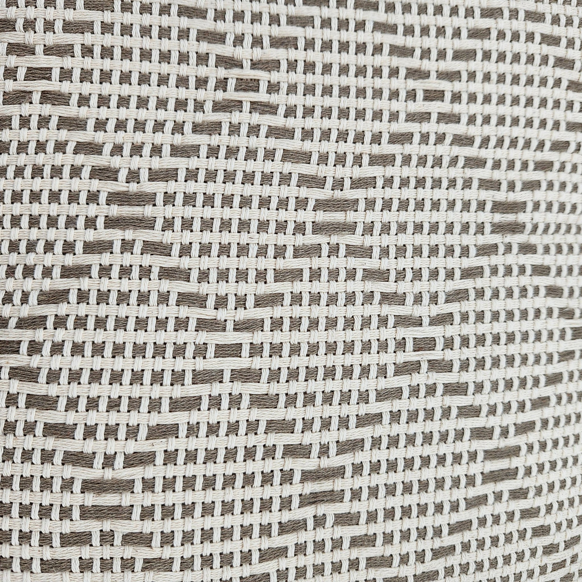 Close up of Portuguese mosaic recycled cotton throw in beige
