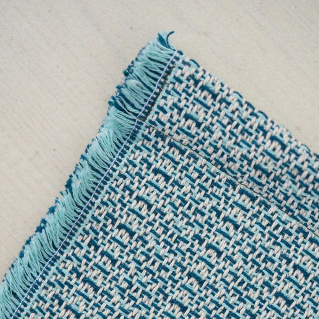Recycled cotton tablecloth in blue and mint, blended weave with fringe