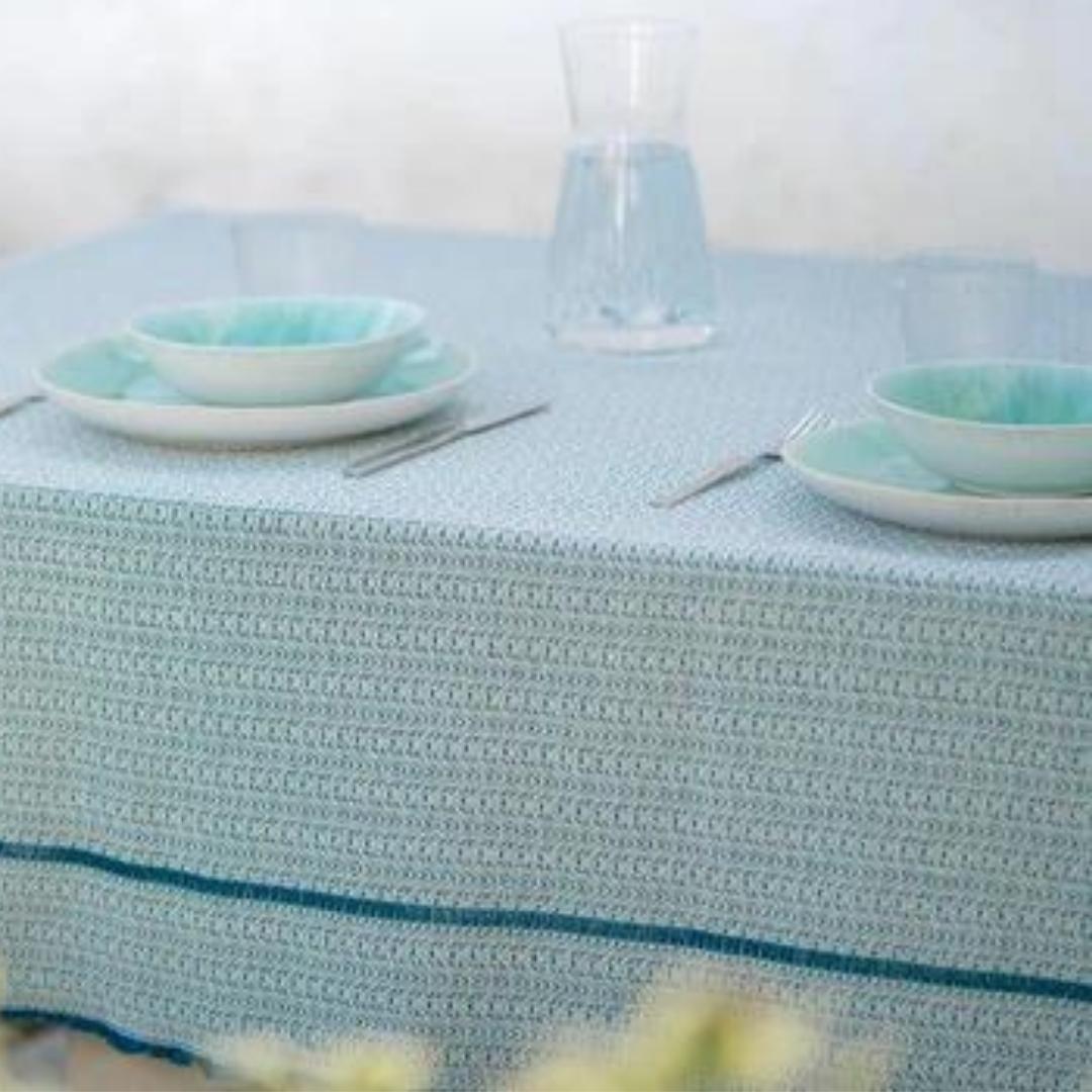 Recycled cotton tablecloth in blue, styled on a table, made in Portugal