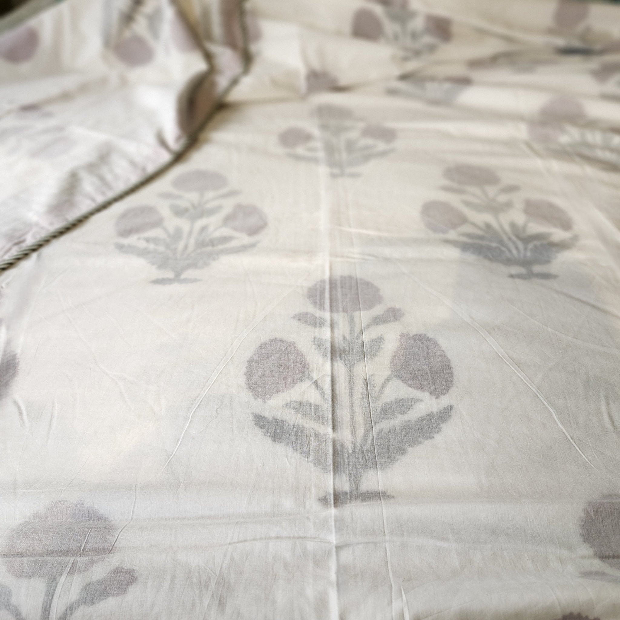 A block print dohar with a red poppy design