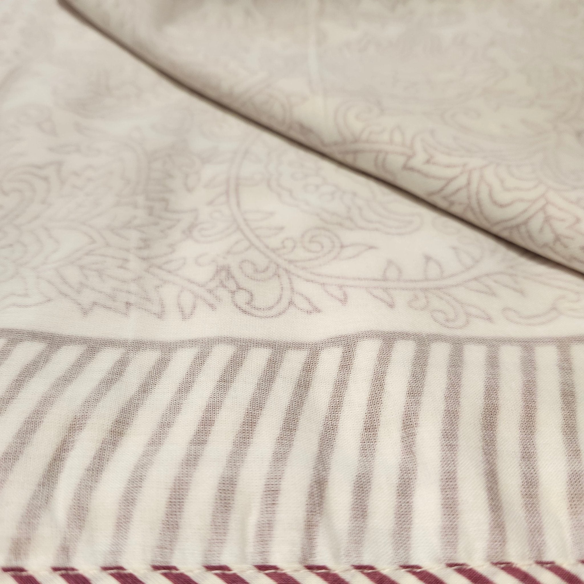 Single block-print cotton dohar blanket in red, 150 by 225 cm, a light alternative to a duvet