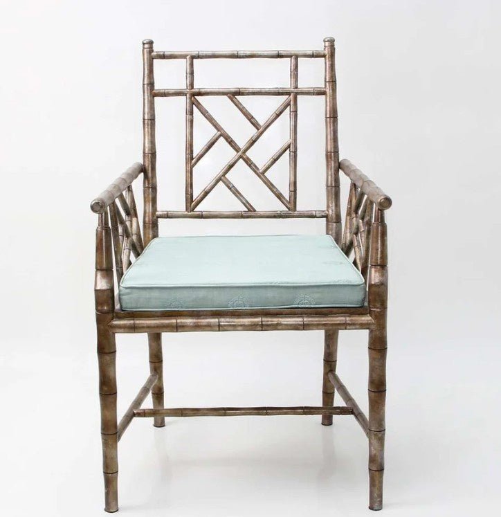 Cora carver easy chair in acacia wood with antique bronze leaf and a teal cushion