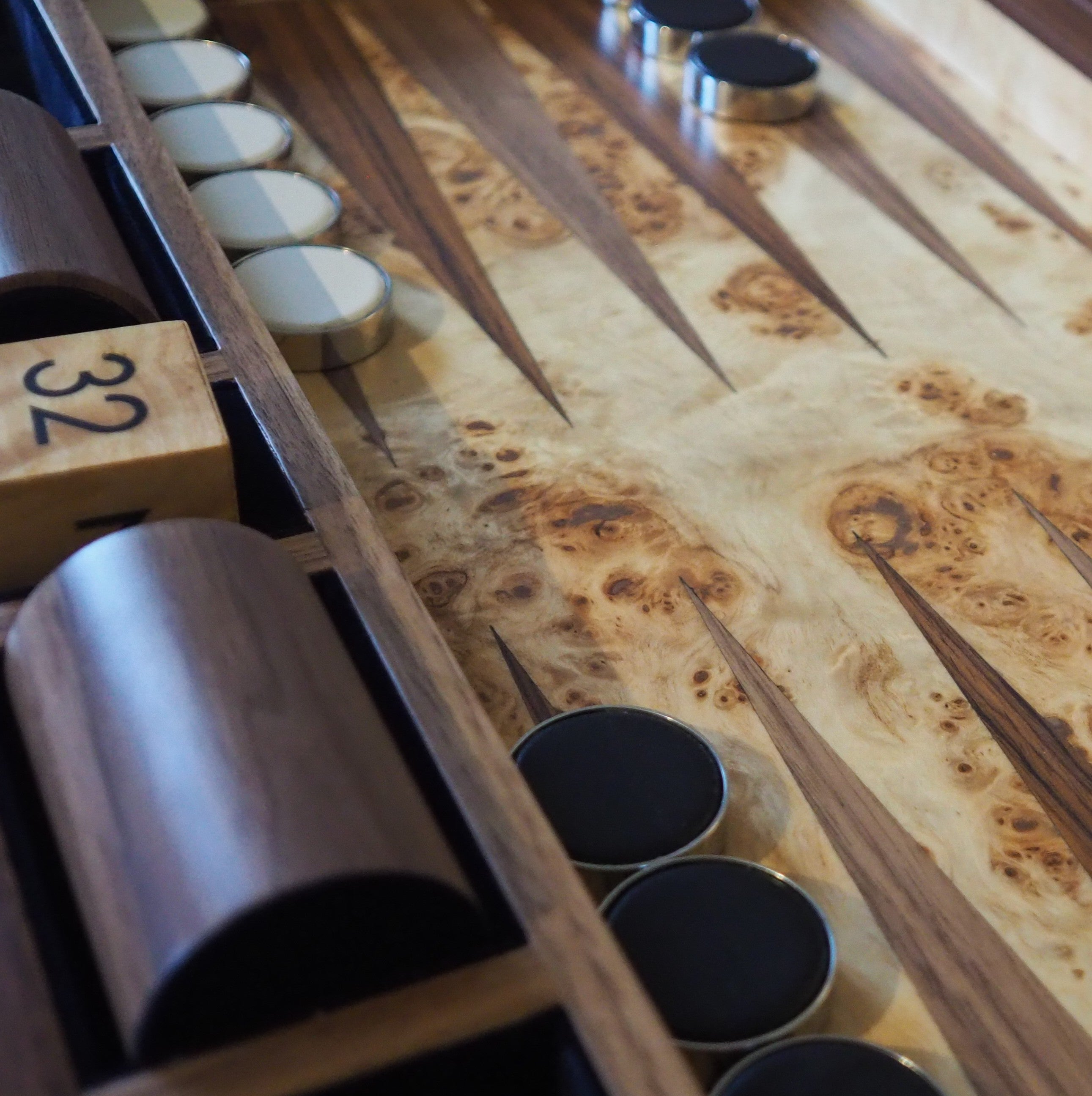 Black faux shagreen backgammon board, 54 x 34 x 8 cm, open showing midnight blue velvet storage