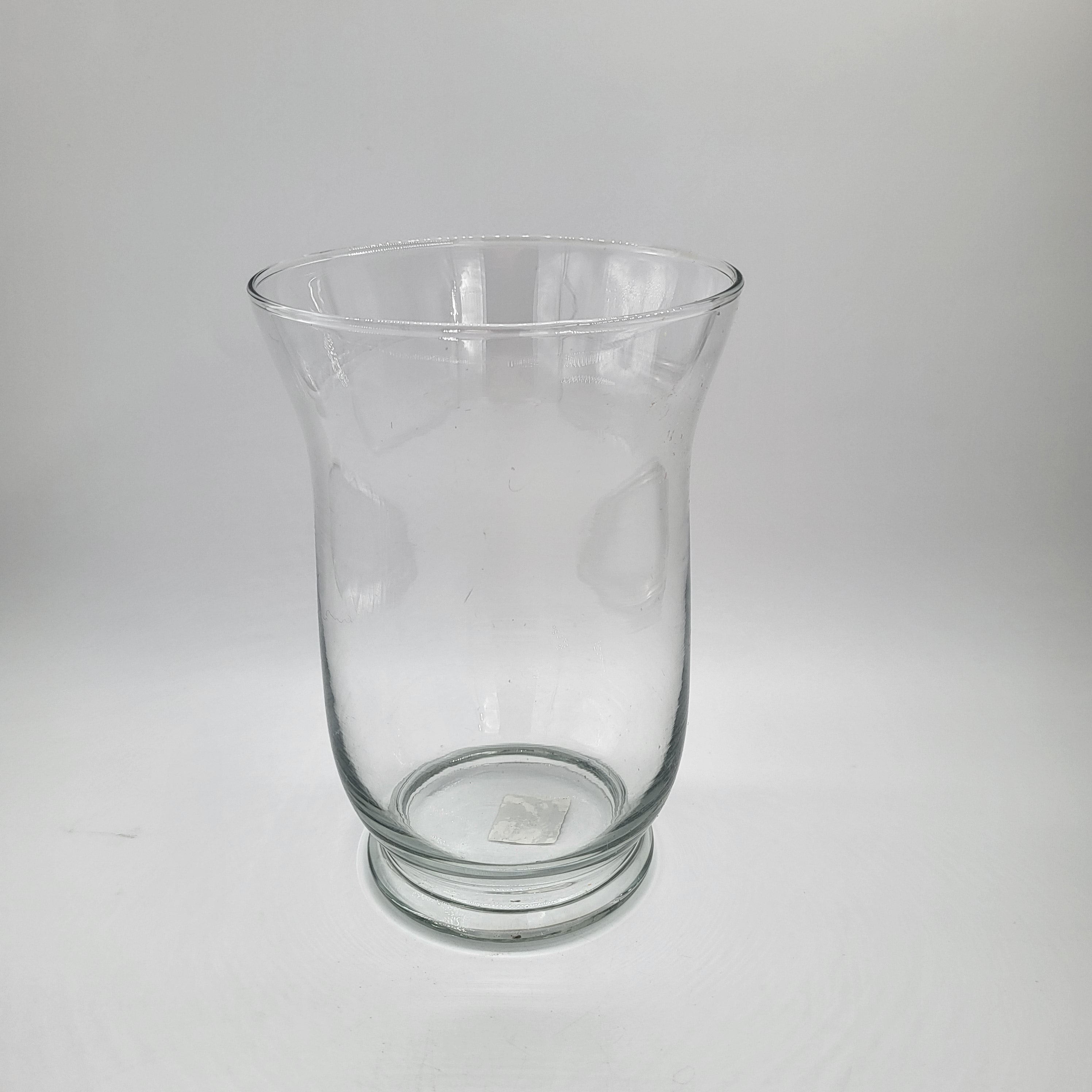 Glass vase or hurricane lamp styled with a candle, three sizes available