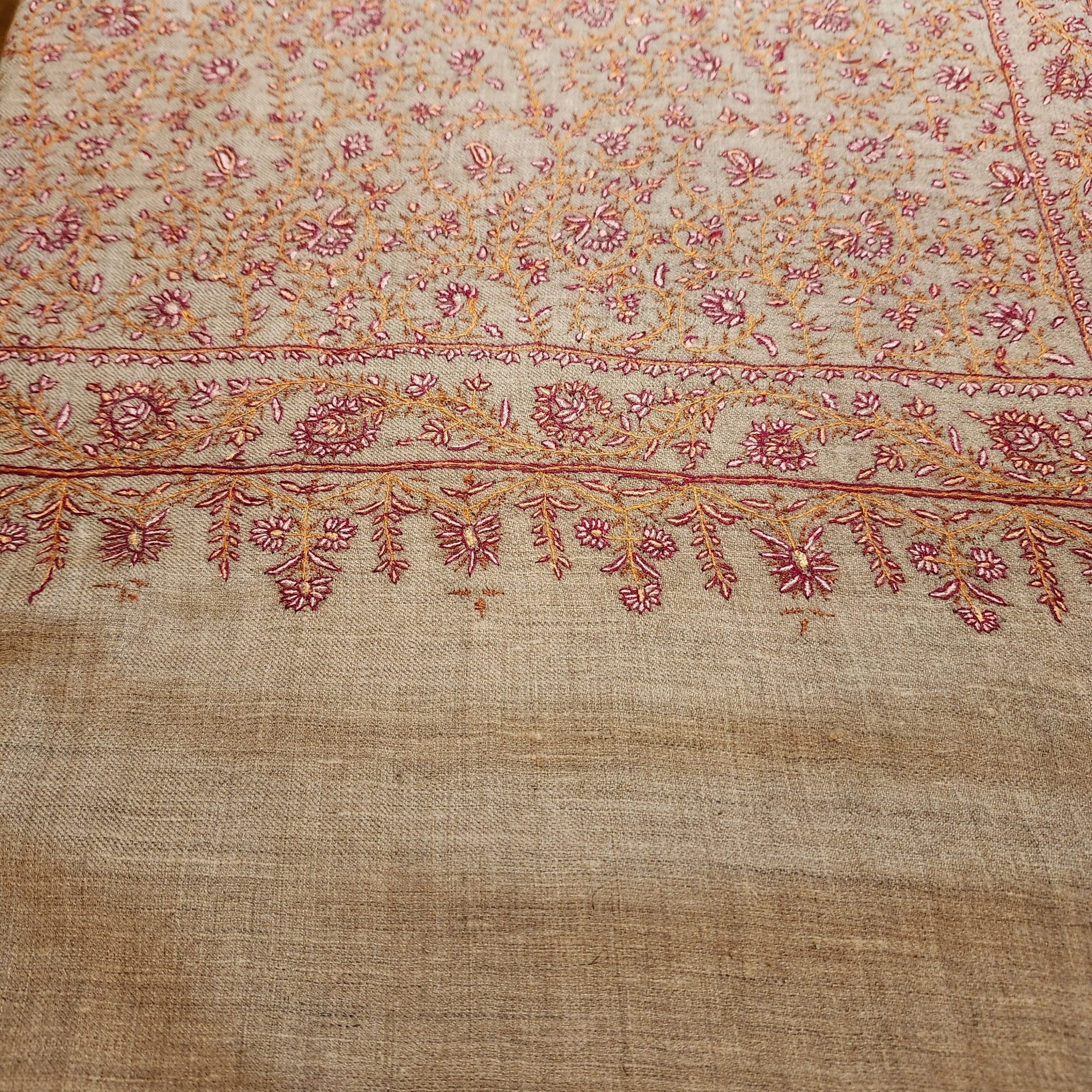 Hand-embroidered natural pashmina shawl, floral border, draped