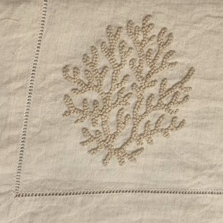 Natural linen runner with coral embroidery, understated, detail view