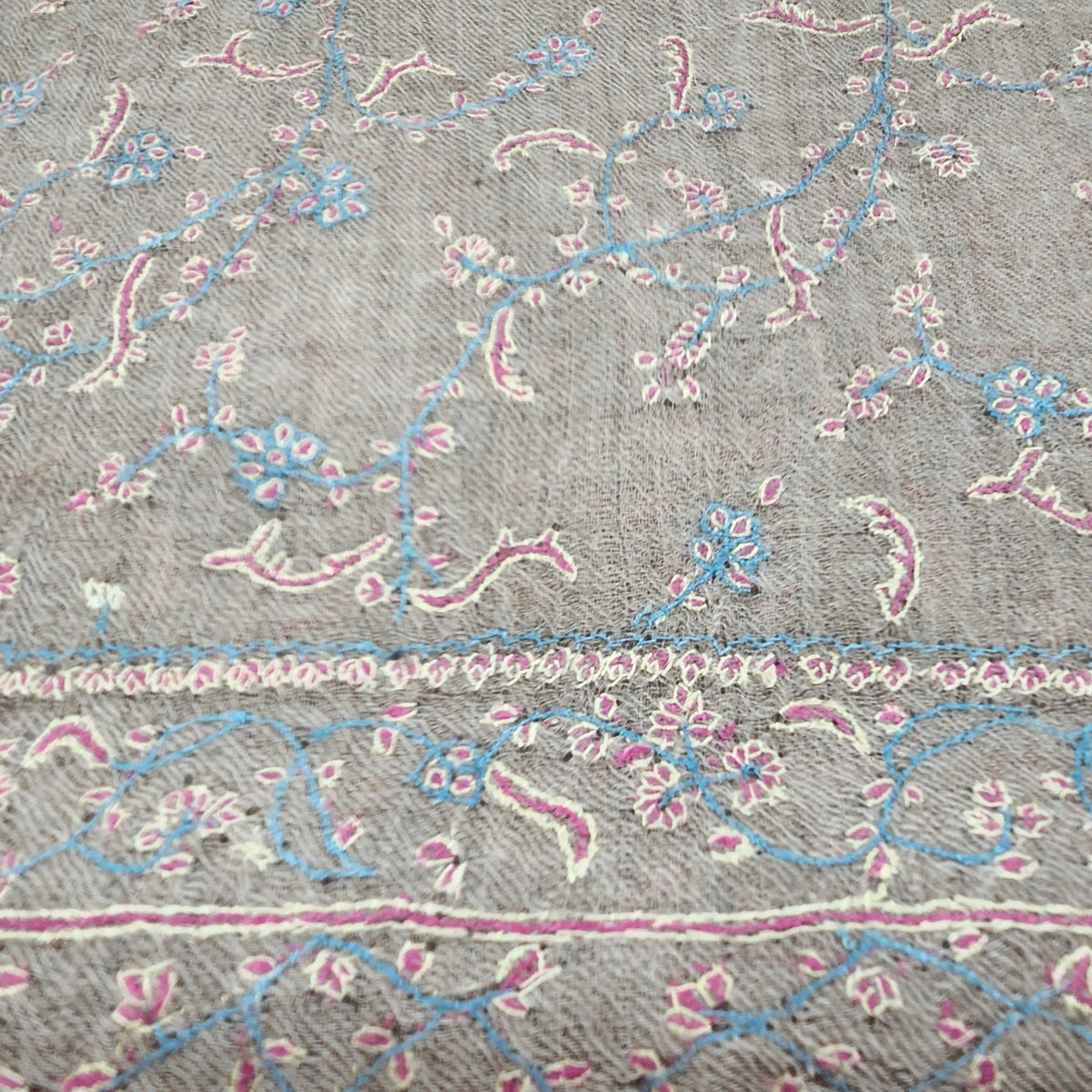 Alternative view of the baby blue hand-embroidered pashmina shawl, showing the delicate floral pattern.
