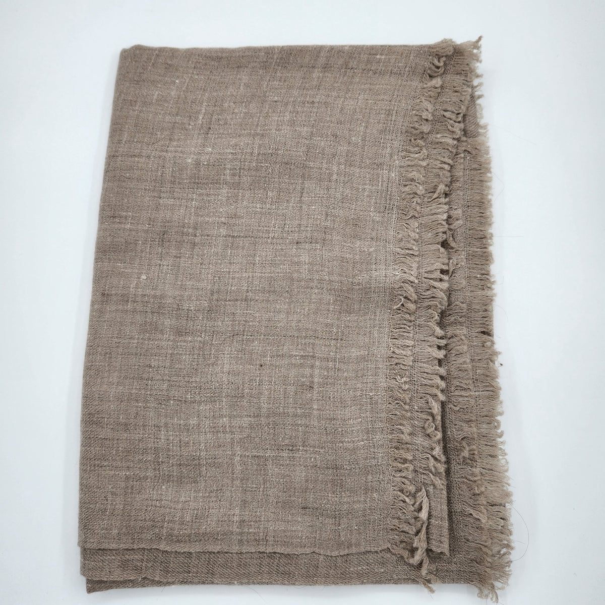 Taupe hand-woven pashmina shawl in 100% pashmina, draped to show the weight and fall of the fabric.