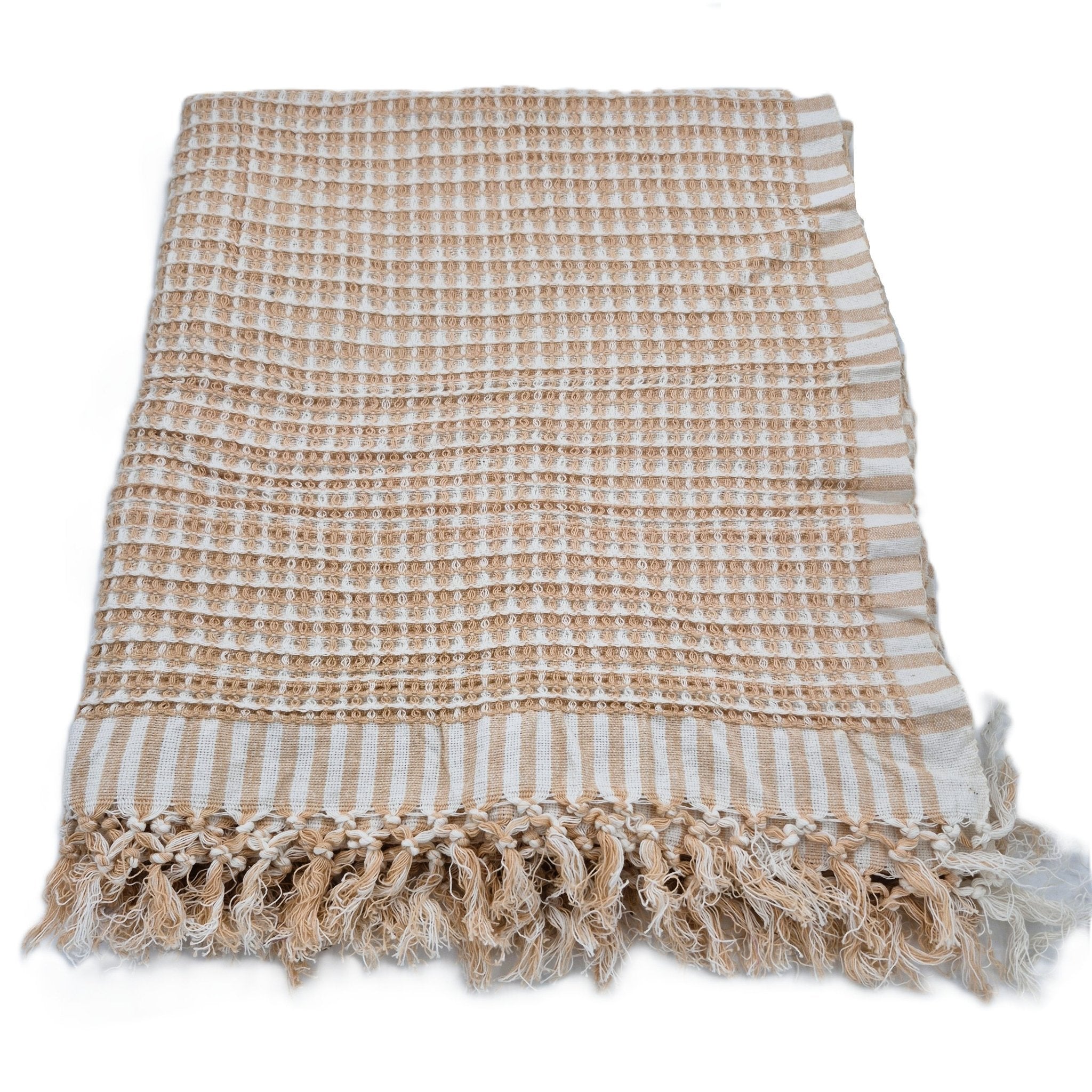 Textured beige and white striped towel with tassels on a white background