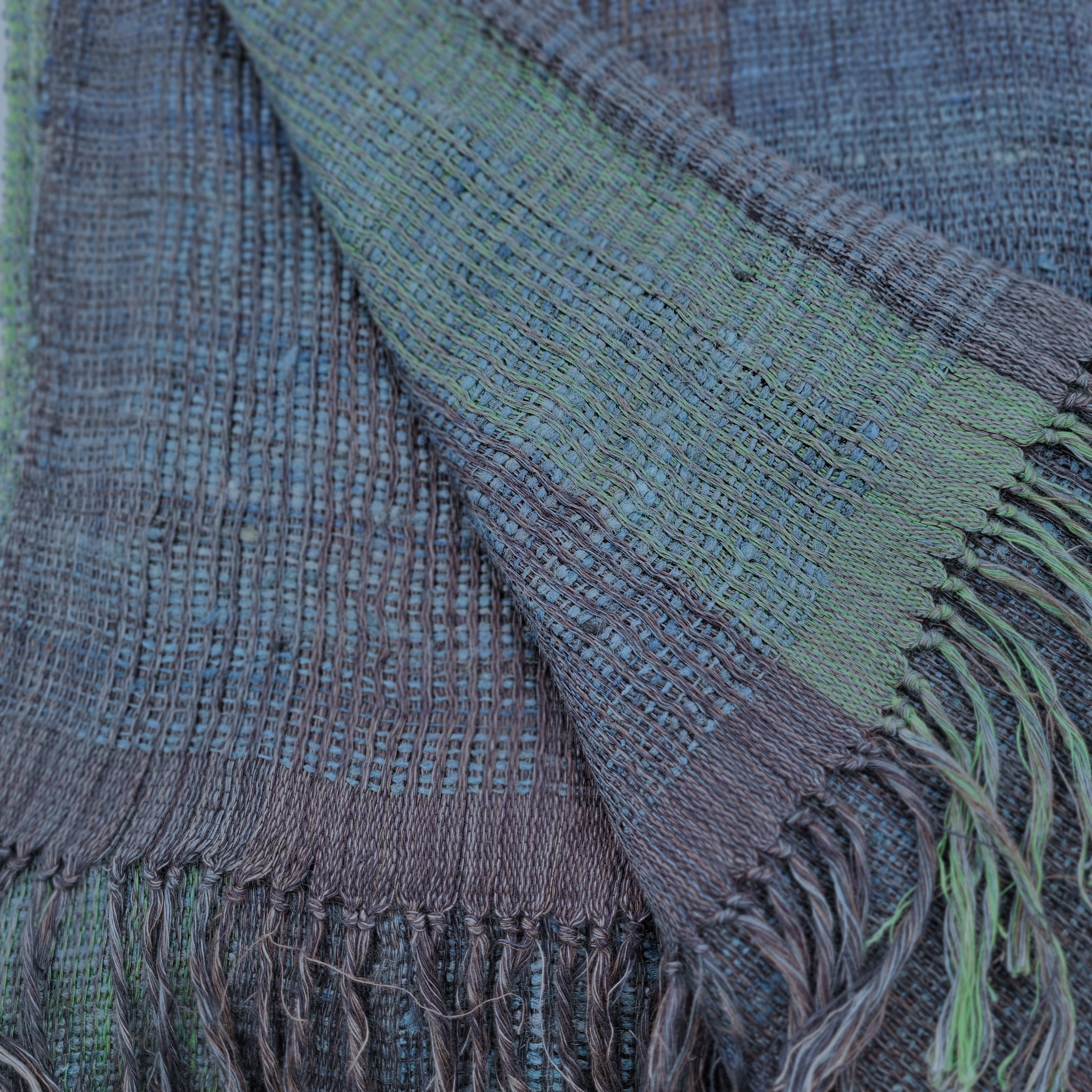 Handwoven linen and silk throw in blue with green bands, detail