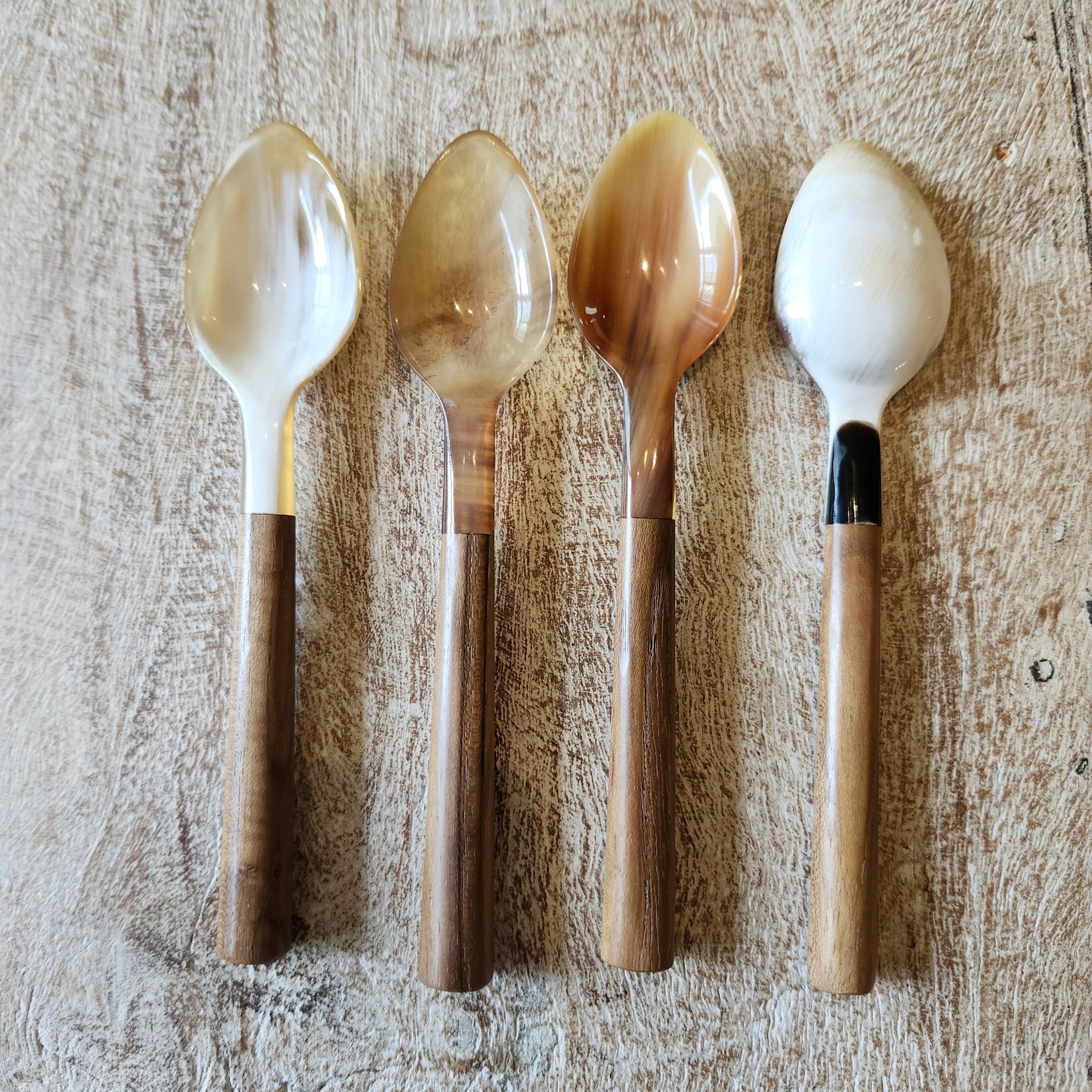Four horn and wood small dessert or tea spoons