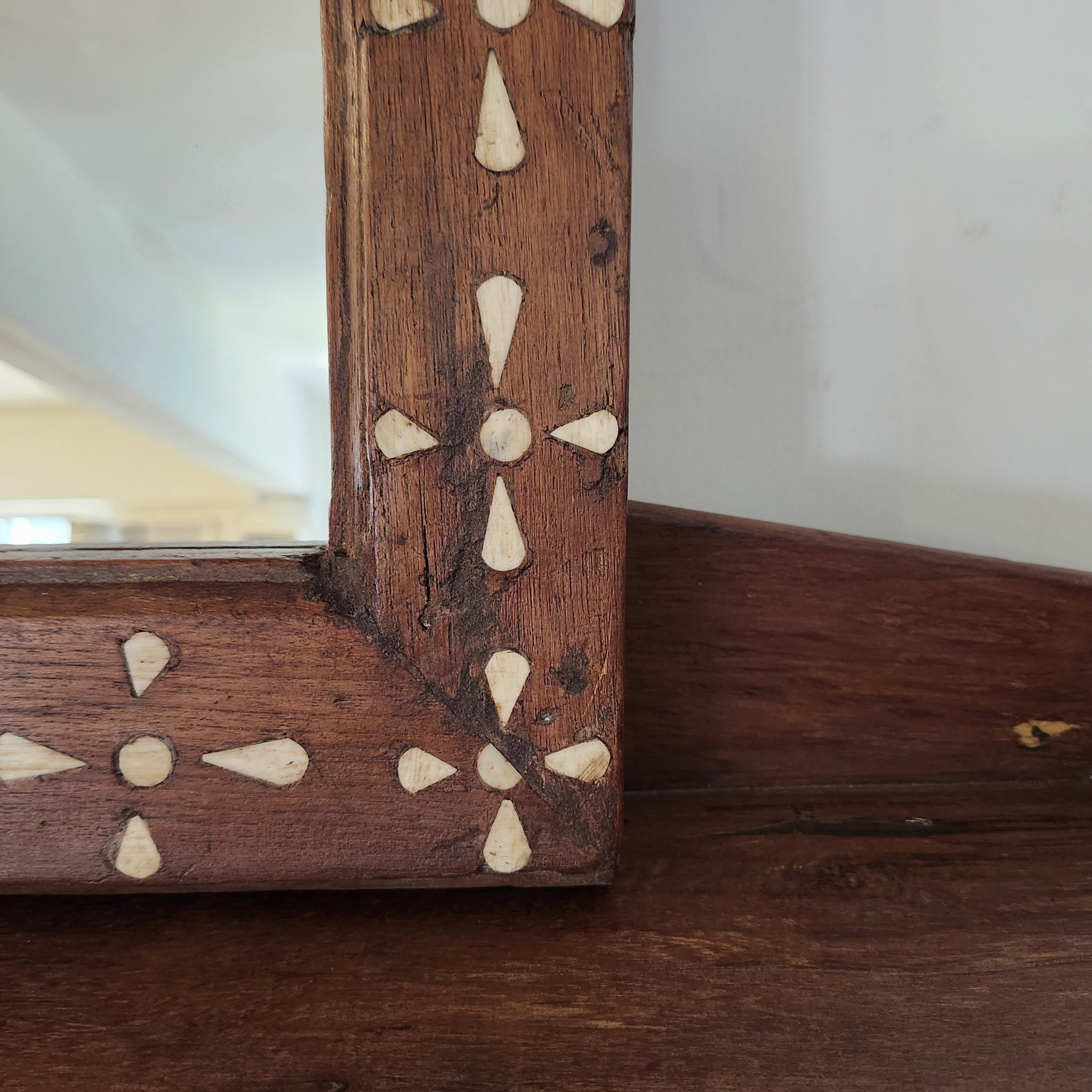 Teak mirror with bone inlay in a repeating motif, handmade