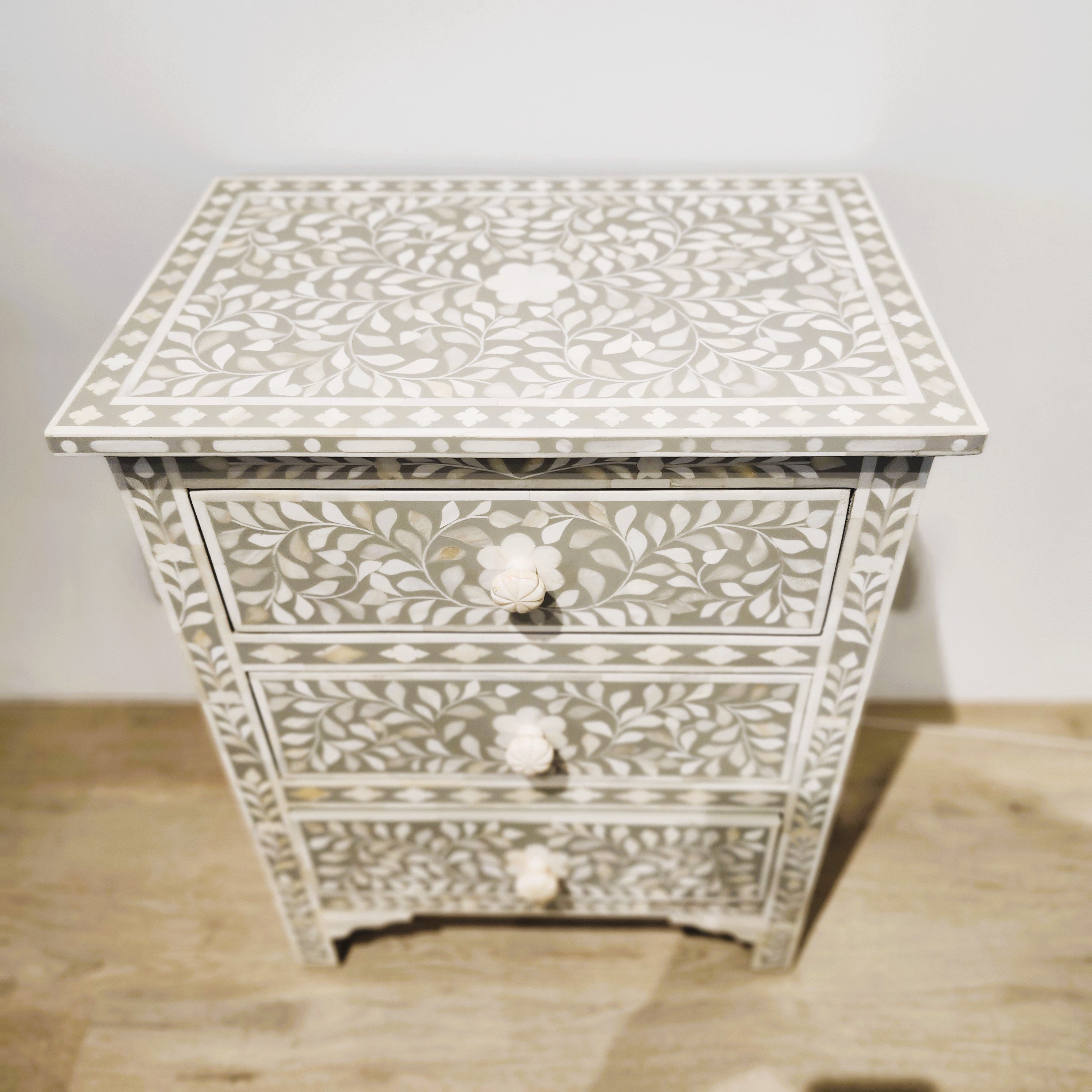 Bone inlay three-drawer bedside table in taupe with a leaf design