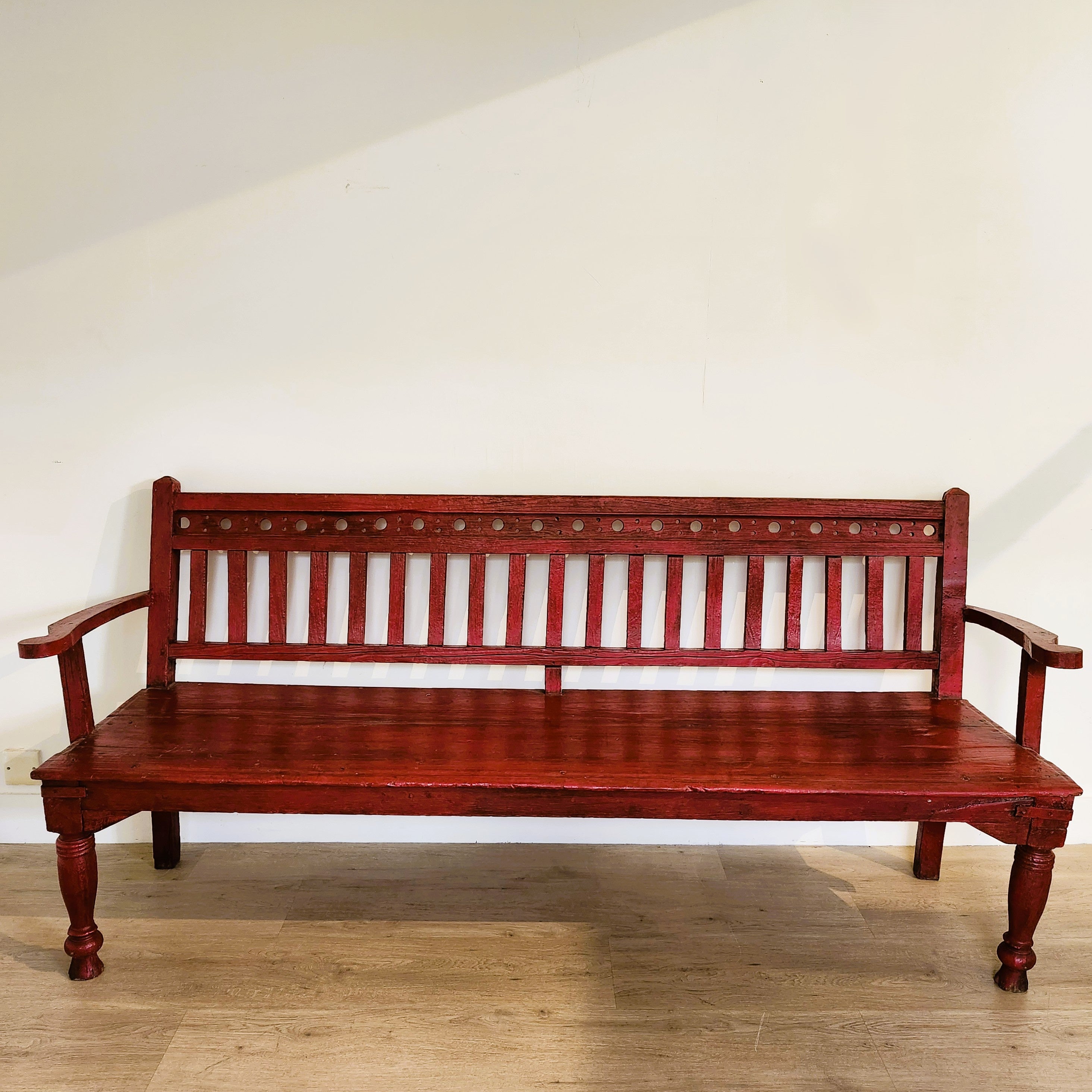 Vintage teak bench in red paint with ikat cushion, 183cm long