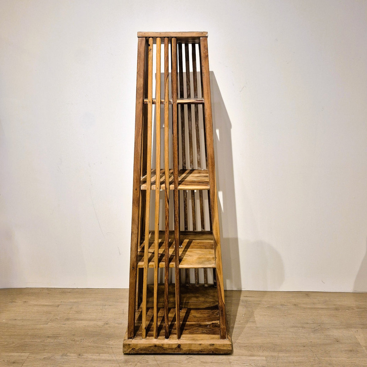 Four sided mango wood bookcase with shelves on every face, 158 cm high and 56 cm square at its widest