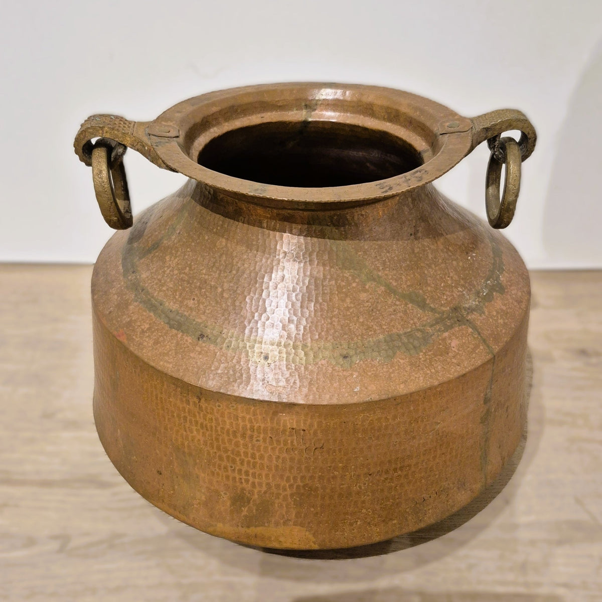 Beaten copper pot 33 cm across and 28 cm high, weighing 3.75 kg, used for plants or simply for display