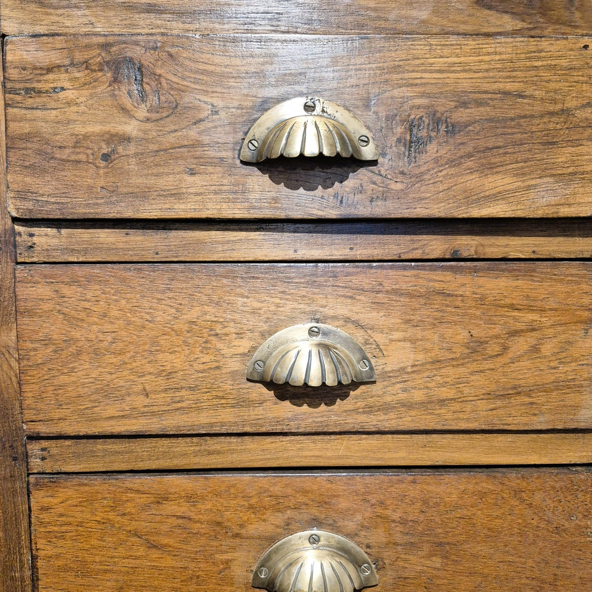 Twenty two drawer vintage teak chest with brass handles, a natural wax finish and a wipe clean surface
