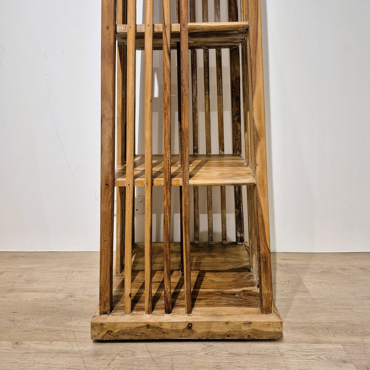 Multi sided book case with four shelves taking books of different sizes, 56 cm wide at its widest point