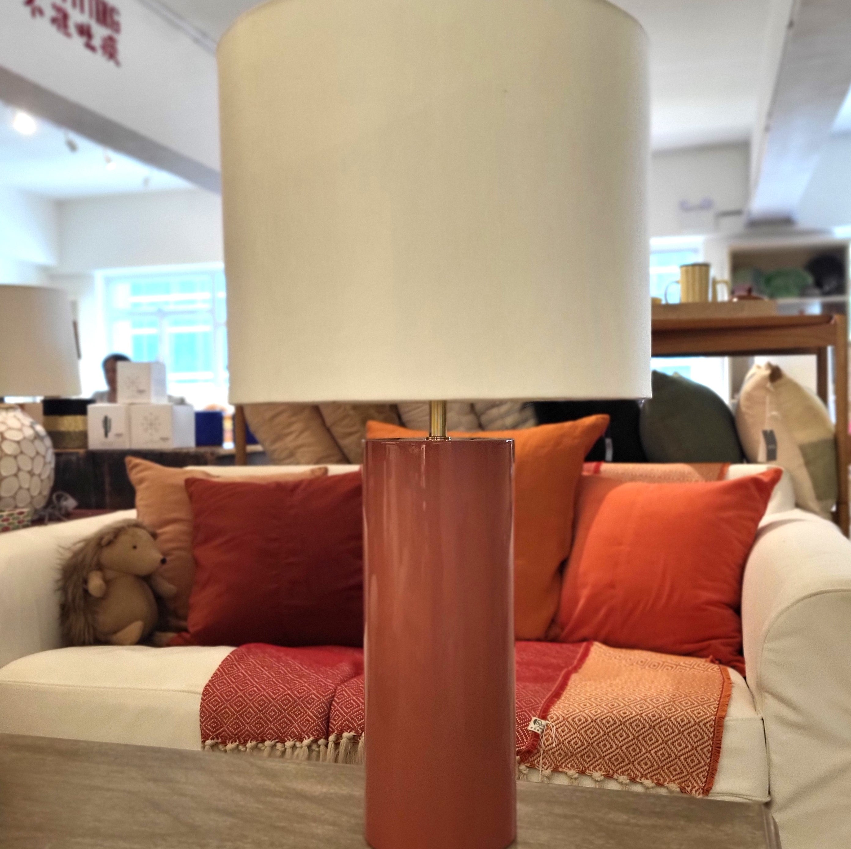 Lacquer table lamp with deep lustrous finish and white drum shade