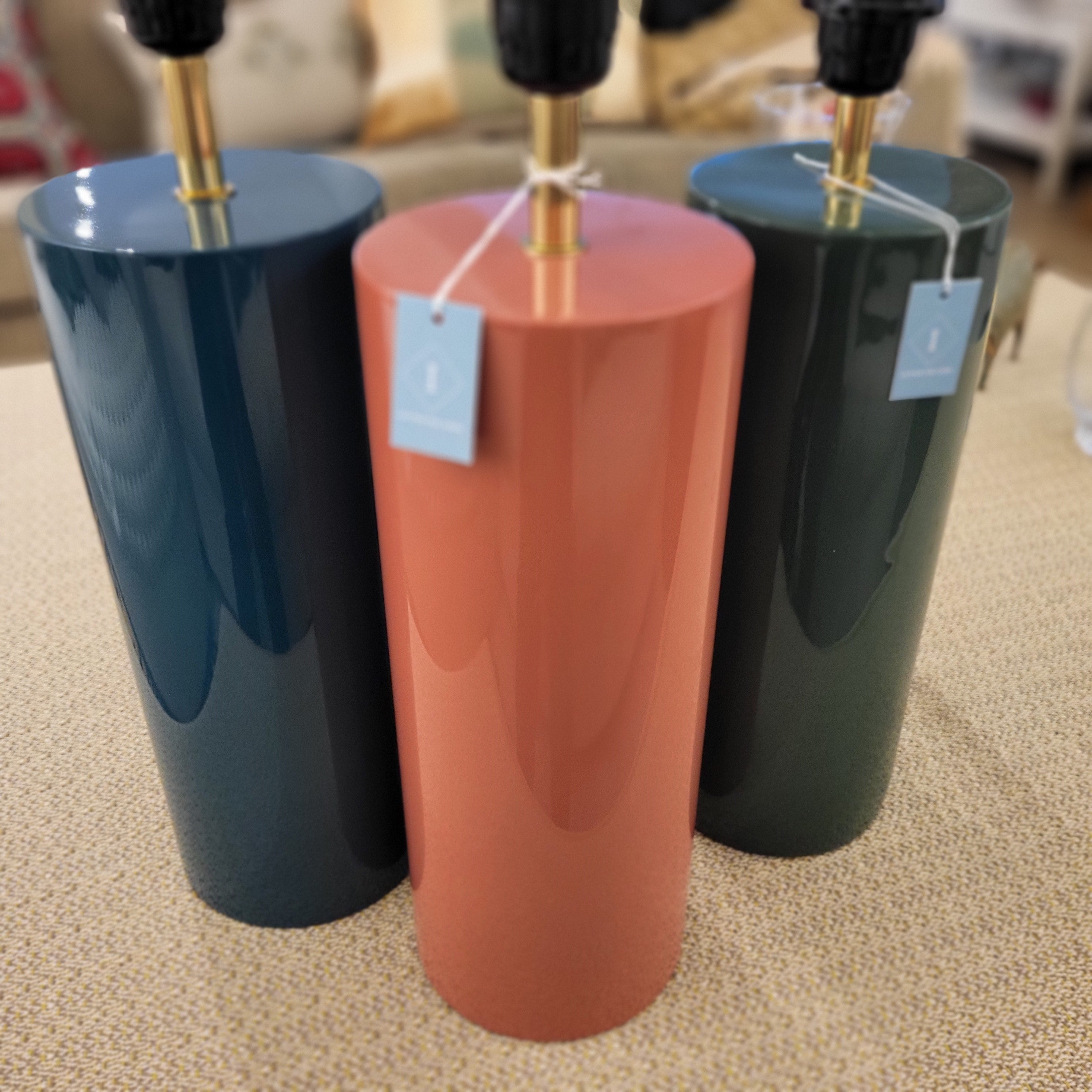 Lacquer table lamp shown in three colours, with white drum shade, 66 cm high