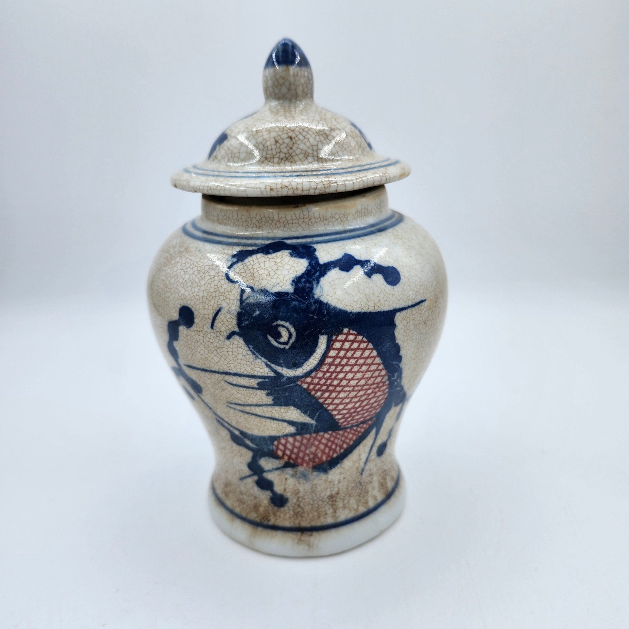Catfish candle, painted ceramic temple jar, detail