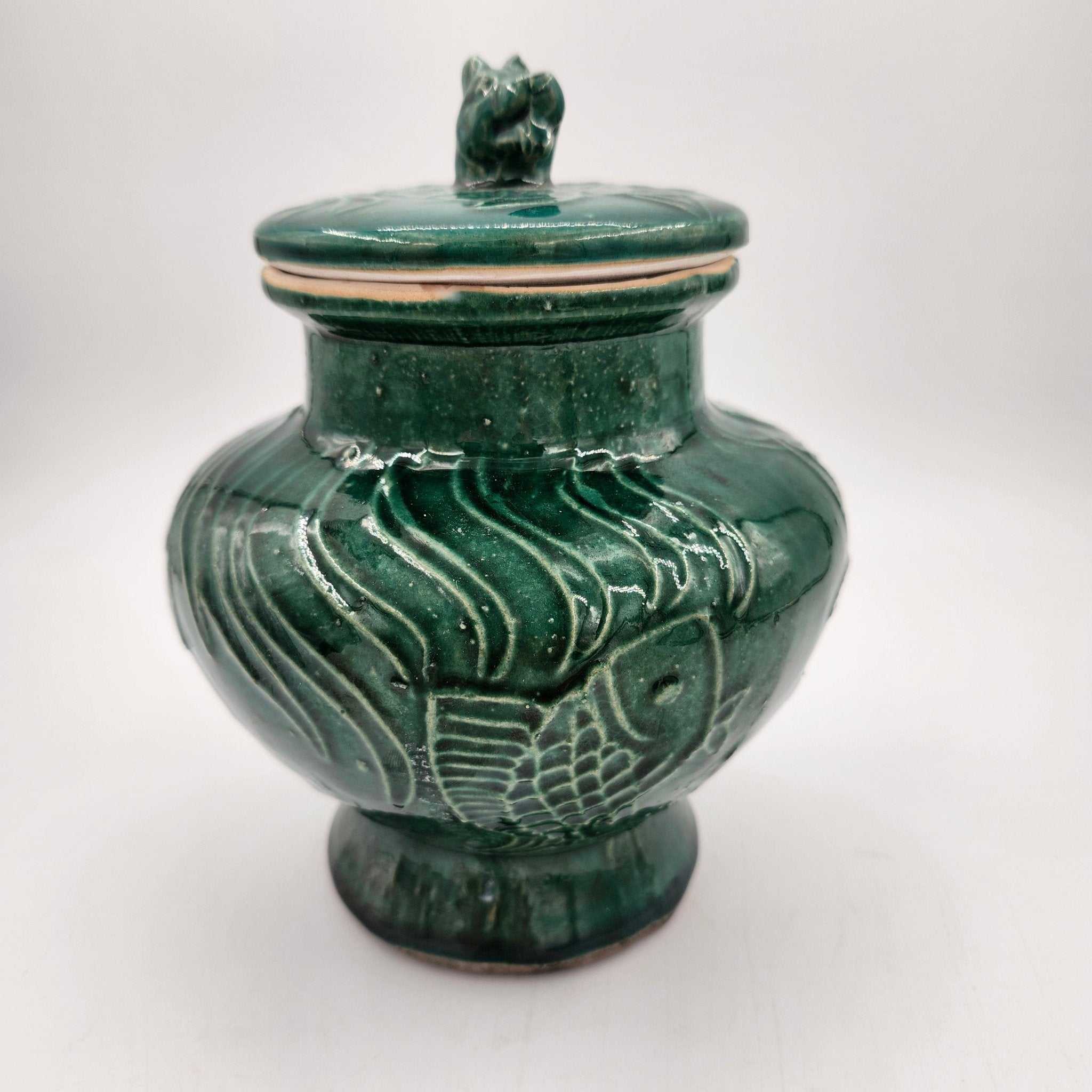 Jade Fish scented candle, deep green vase with fish motif and dog's head lid, organic soy wax