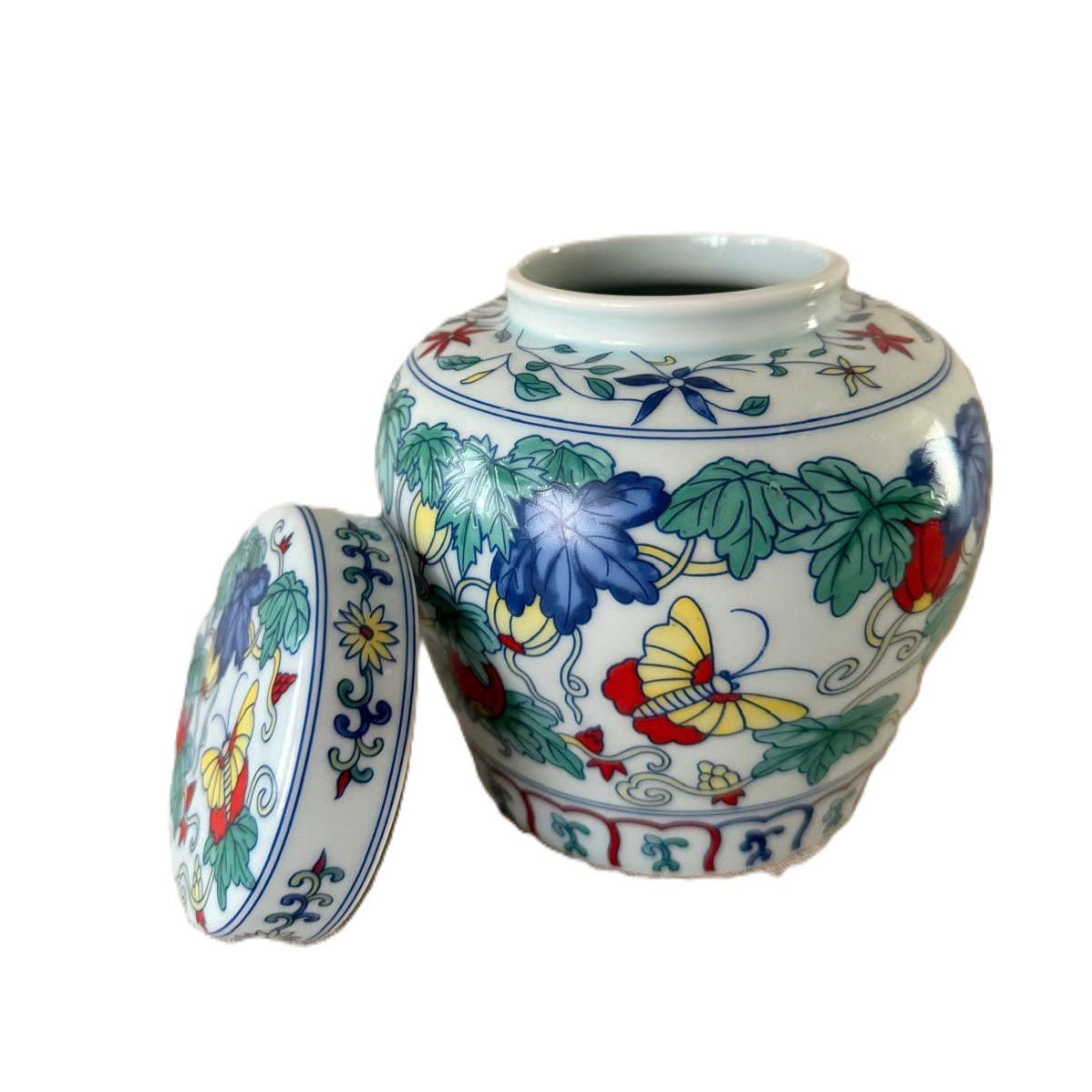 Butterfly Garden scented candle in blue and white ceramic pot with three wicks