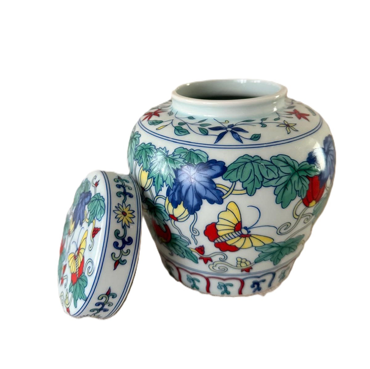 Butterfly Garden scented candle in blue and white ceramic pot with three wicks