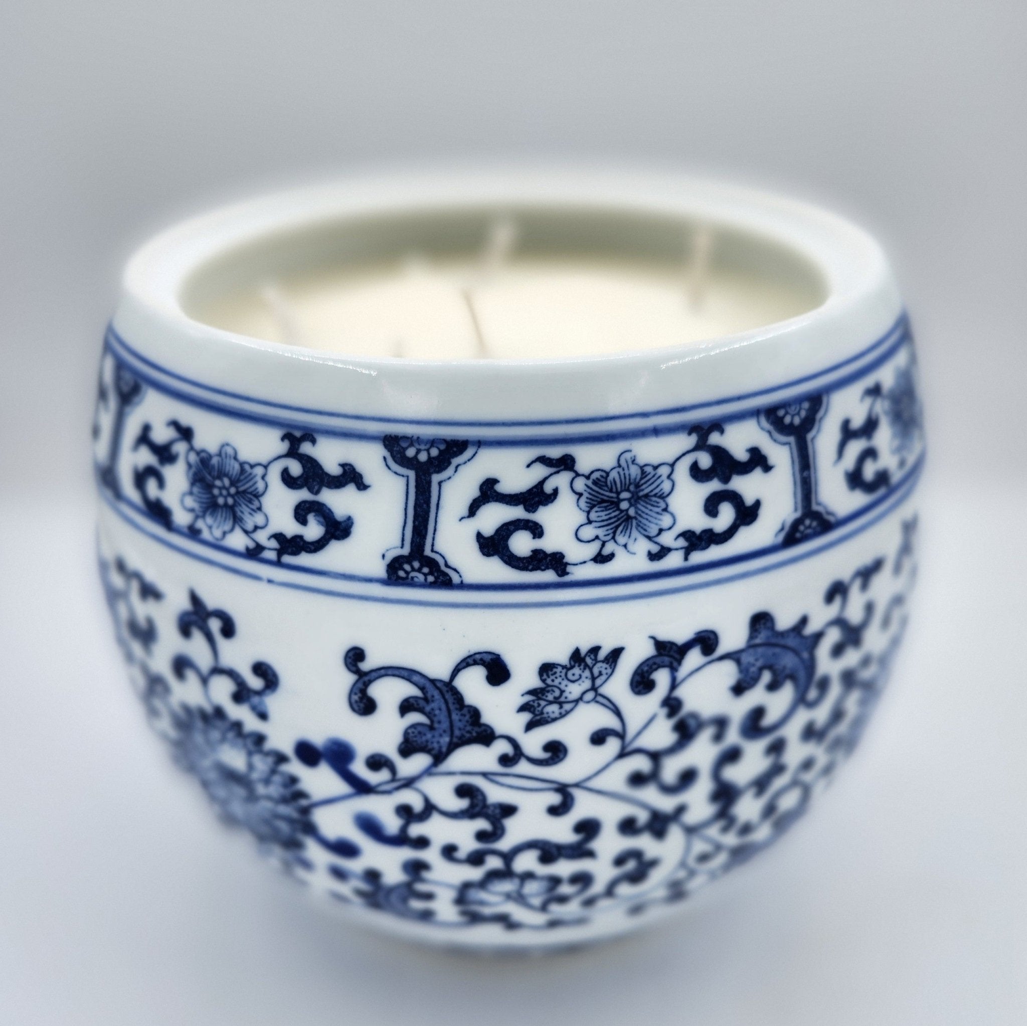 Chrysanthemum candle, chrysanthemum-painted ceramic jar, styled view