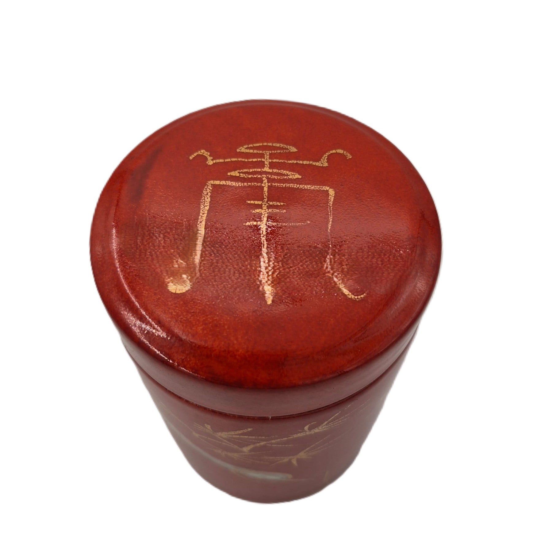 Red Crane candle, crane and gold branches on red pot, detail